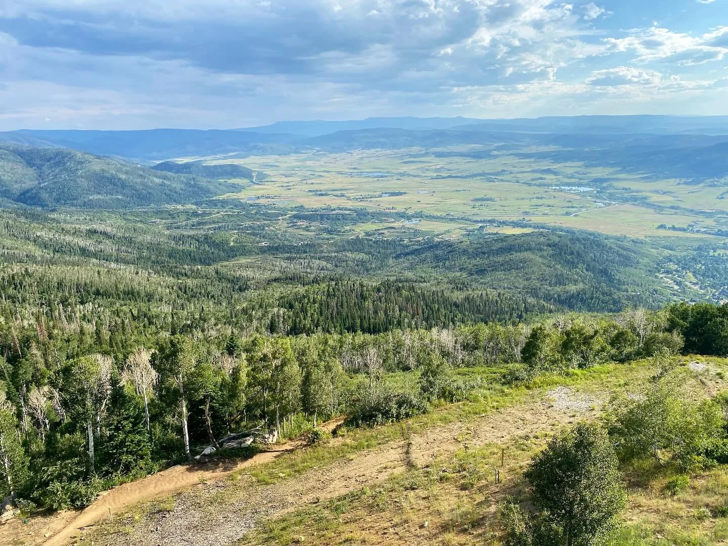 view of the yampa valley from sunset happy hour at @steamboatresort #colorado