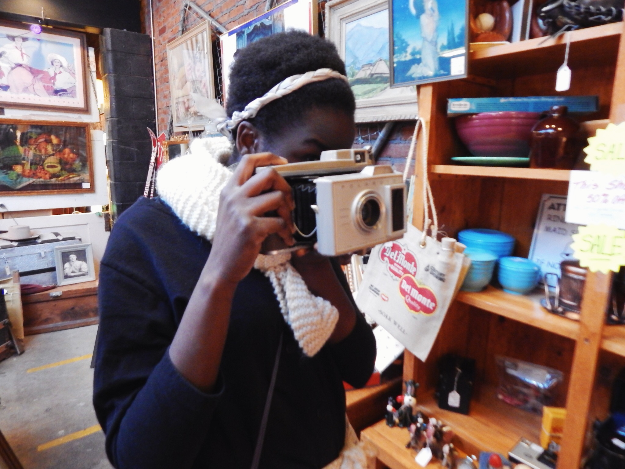 Holly loved the old cameras at Tossed & Found. 