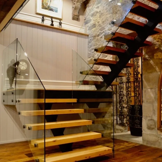 stone+farmhouse+renovation+steel+stair+timber+tread+open+riser+glass+railng.jpg