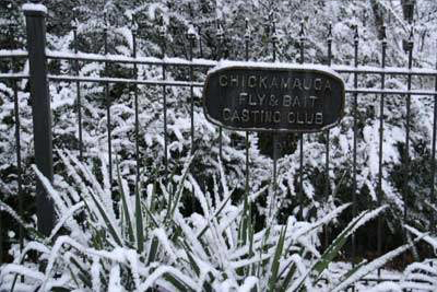 snow on club sign at gate.png