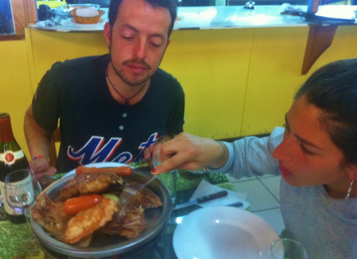  Christobal and Pollo dividing up our&nbsp; parillada . &nbsp;I got the cordero :) 