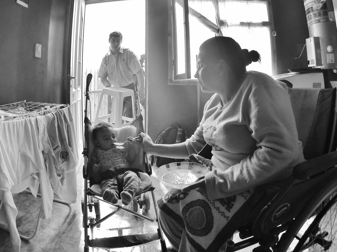 Adrian's wife feeds her niece. Adrian's brother lives next door and is the one who suggested that Adrian bring his family to Puerto San Julián after they left Spain