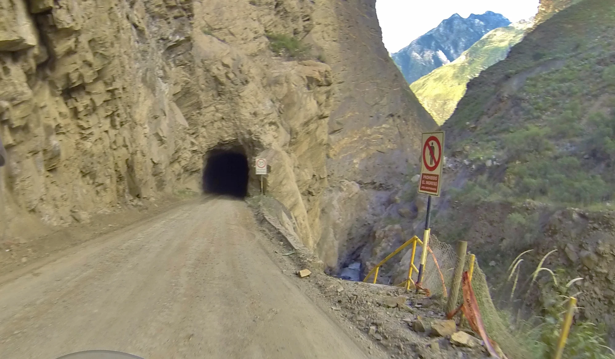 Most tunnels are too long to see through from end to end. Make sure your horn and brakes work before riding this road