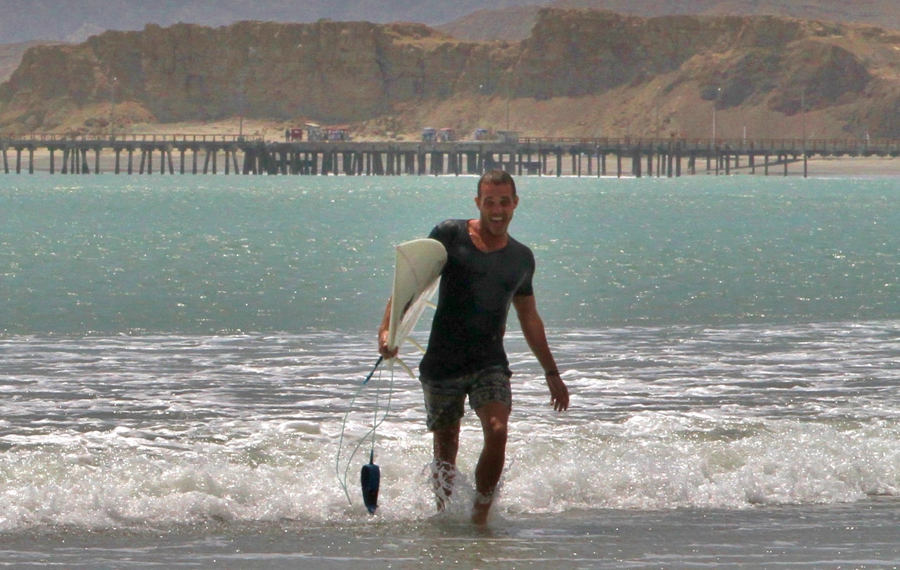  His surfboard brings all the boys to the yard 