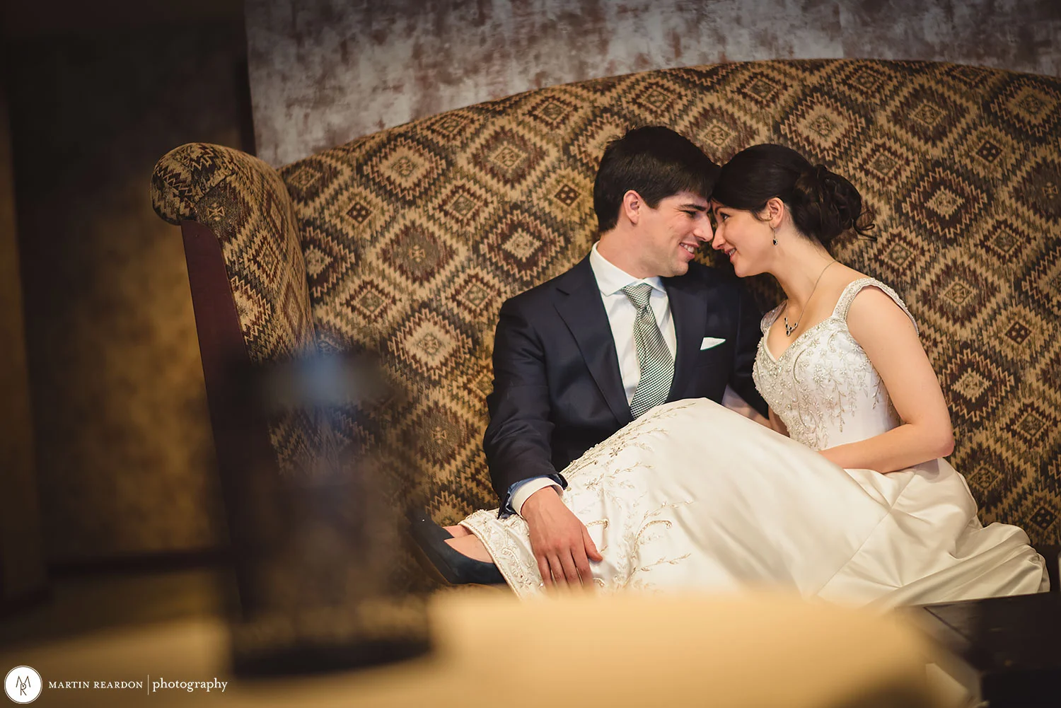 11-Bride-And-Groom-Sitting-On-Couch.jpg