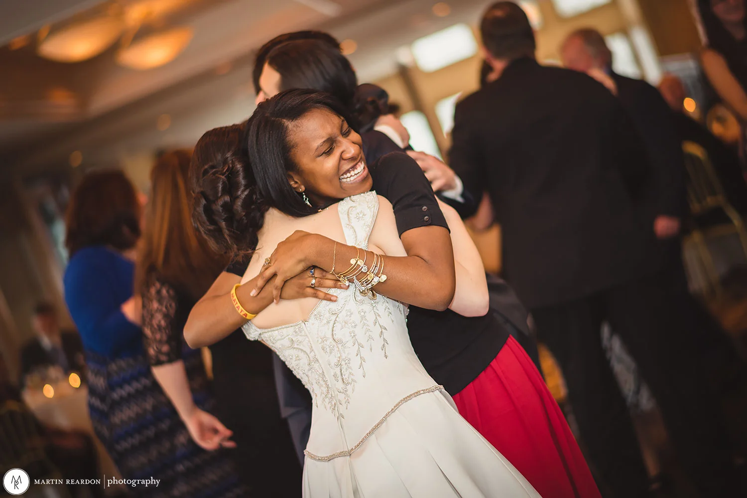 17-wedding-reception-hug-bride.jpg