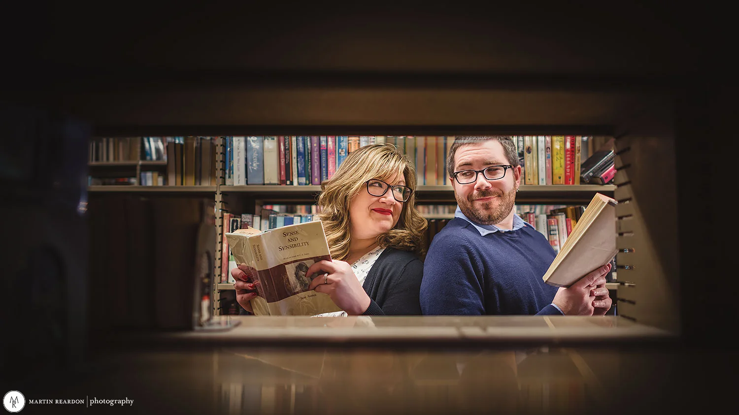 Engagement-shoot-couple-in-library-looking-back.jpg