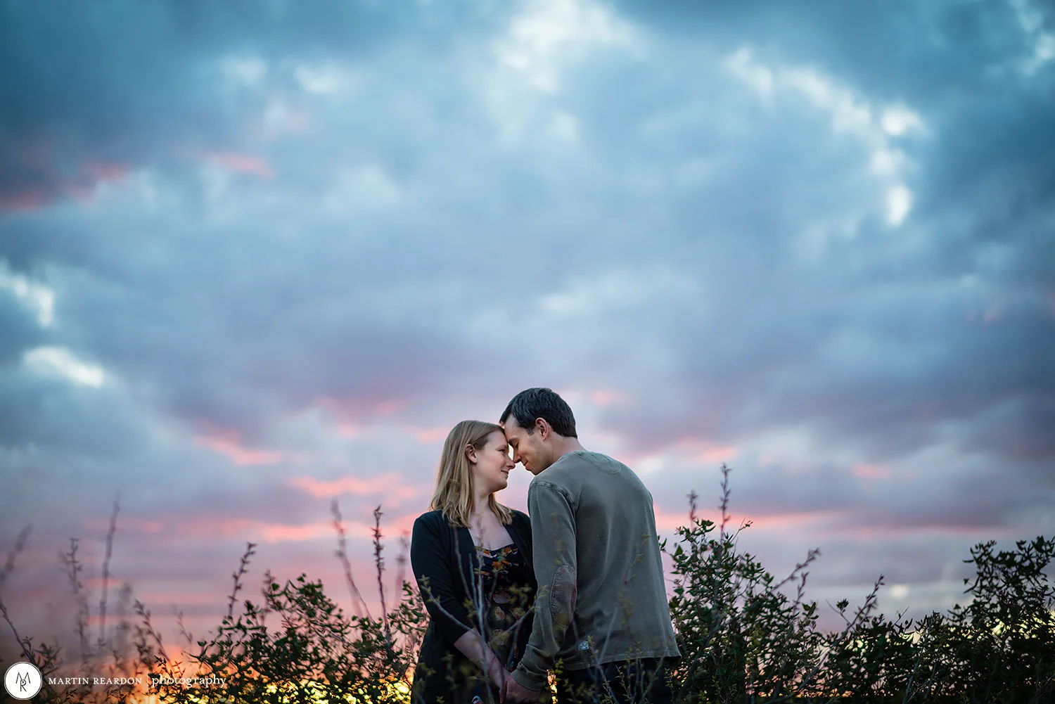Engagement photo couple with dramatic sky