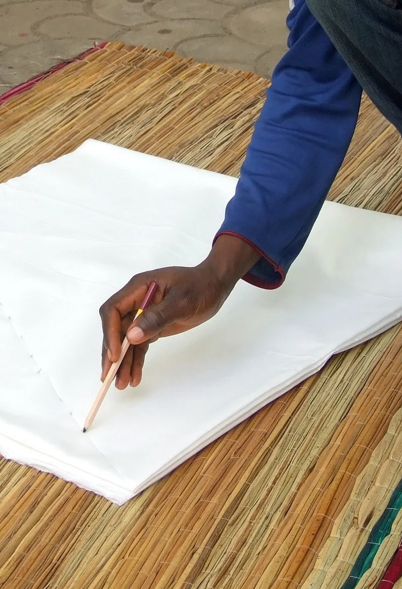 Drawing lines on fabric for Tie-dye.JPG