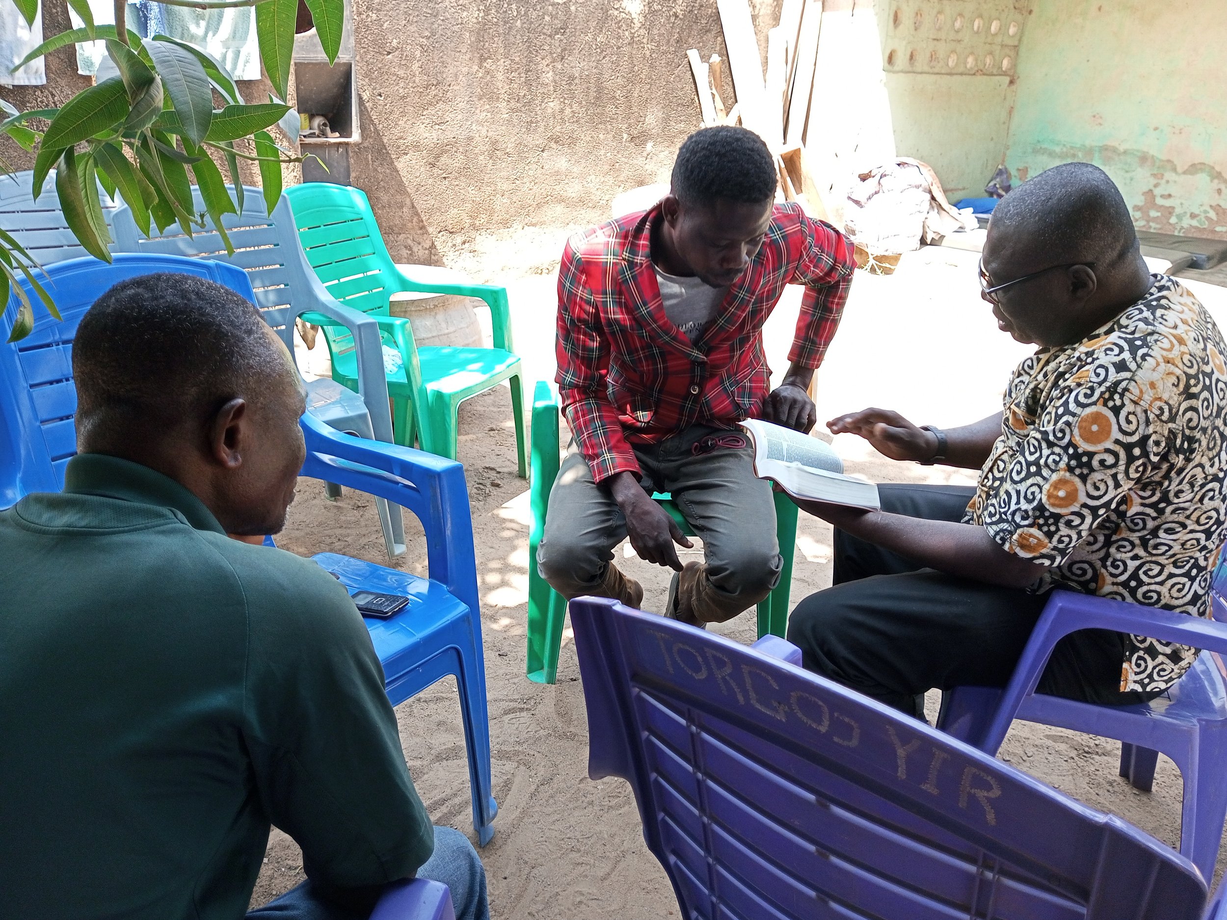 ADJEI AND GYAN MANTE STUDYING WITH A PROSPECT.jpg