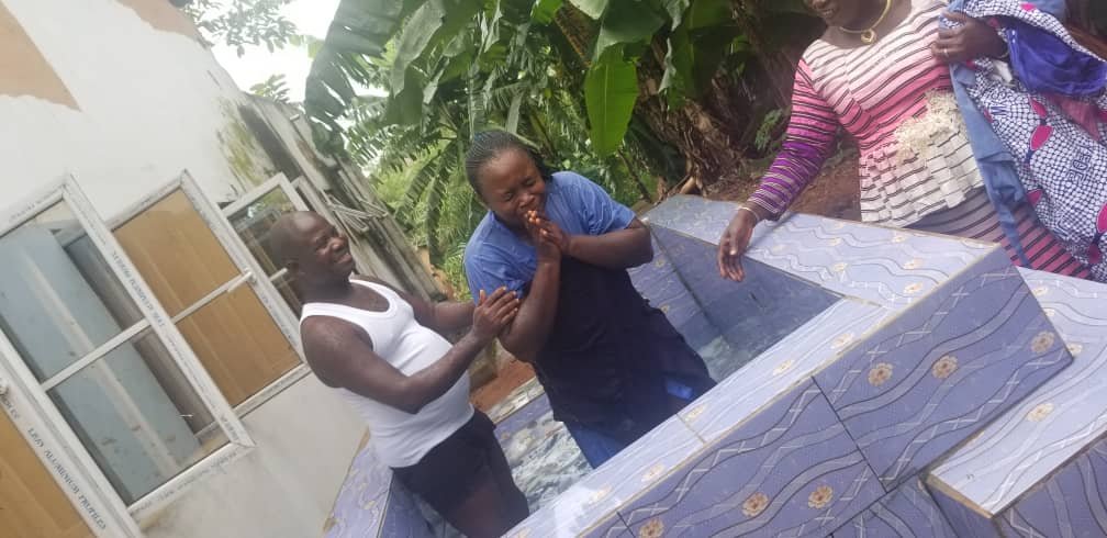 A student Brother Jeremiah Osahon baptizing Faith Ukem in one of our recent outing.jpg