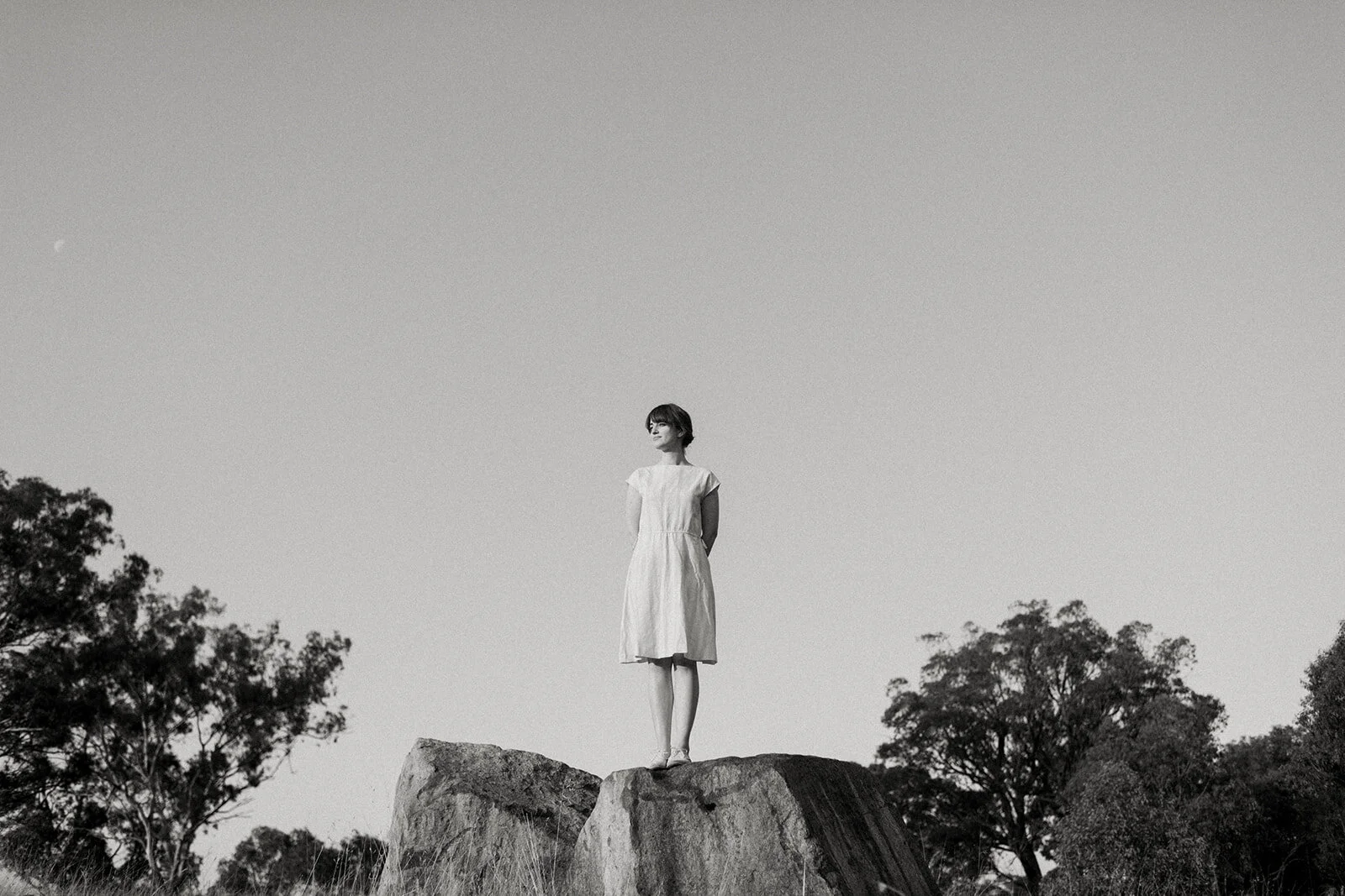 Fine-art portait of a woman in the Australian bush, taken in black and white.