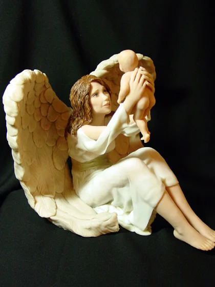 e_angel_holding_baby_in_air.jpg