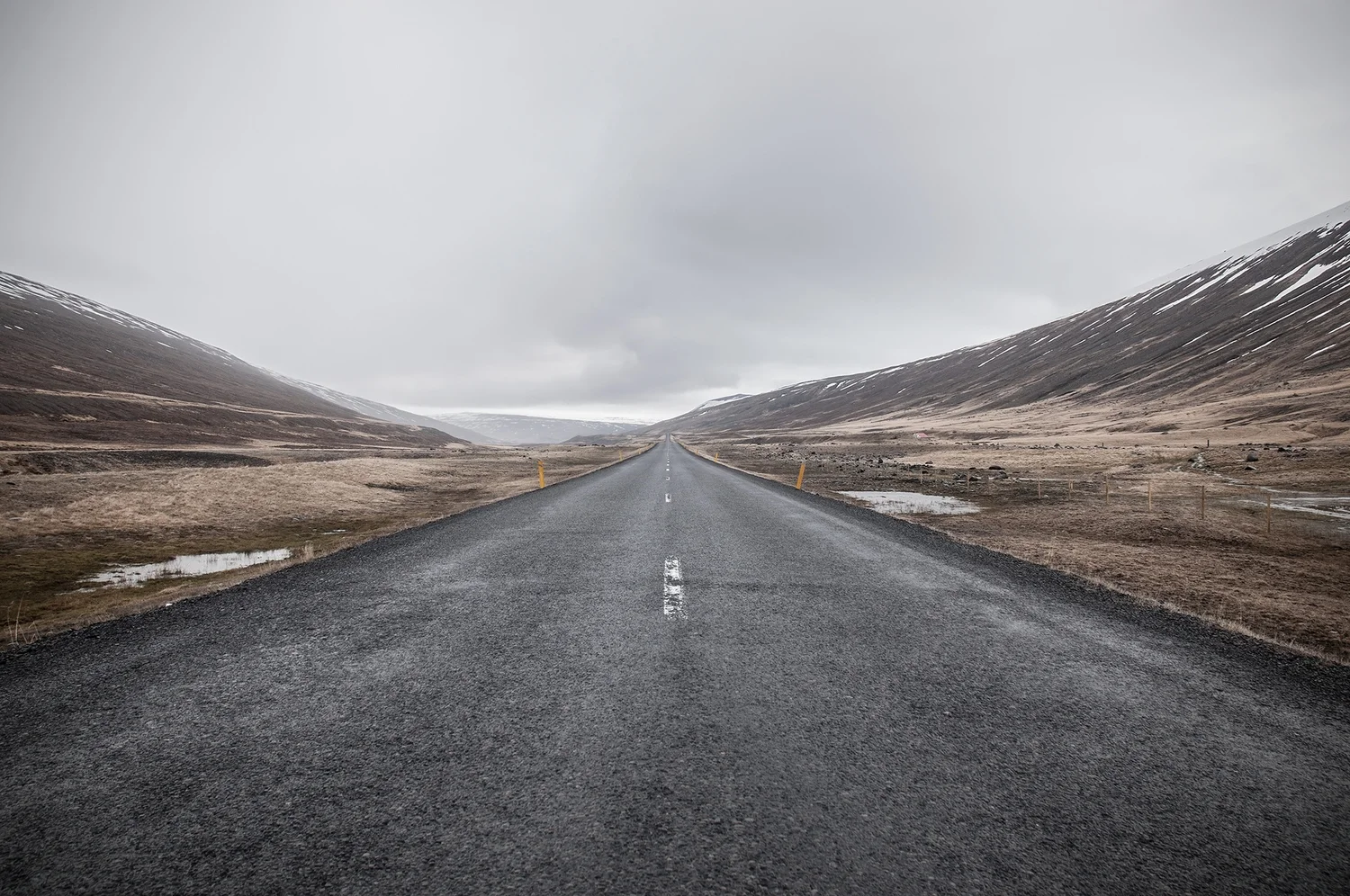 road-alone-clouds-hills.jpg