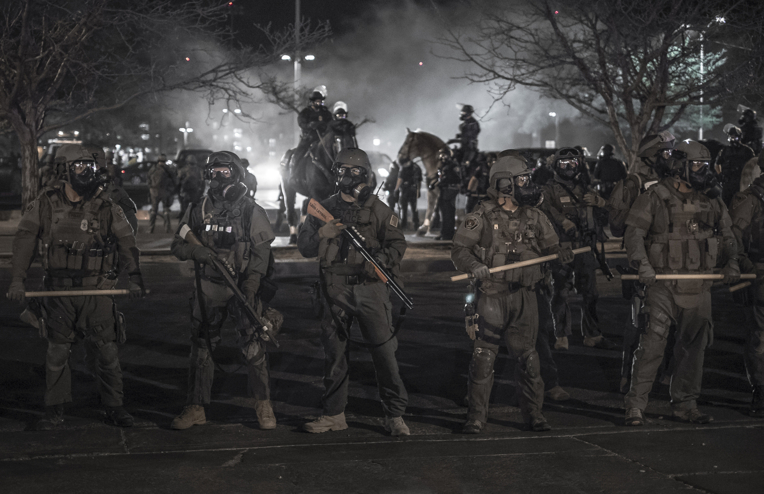 Albuquerque riot police force protesters off the streets on Central Avenue.