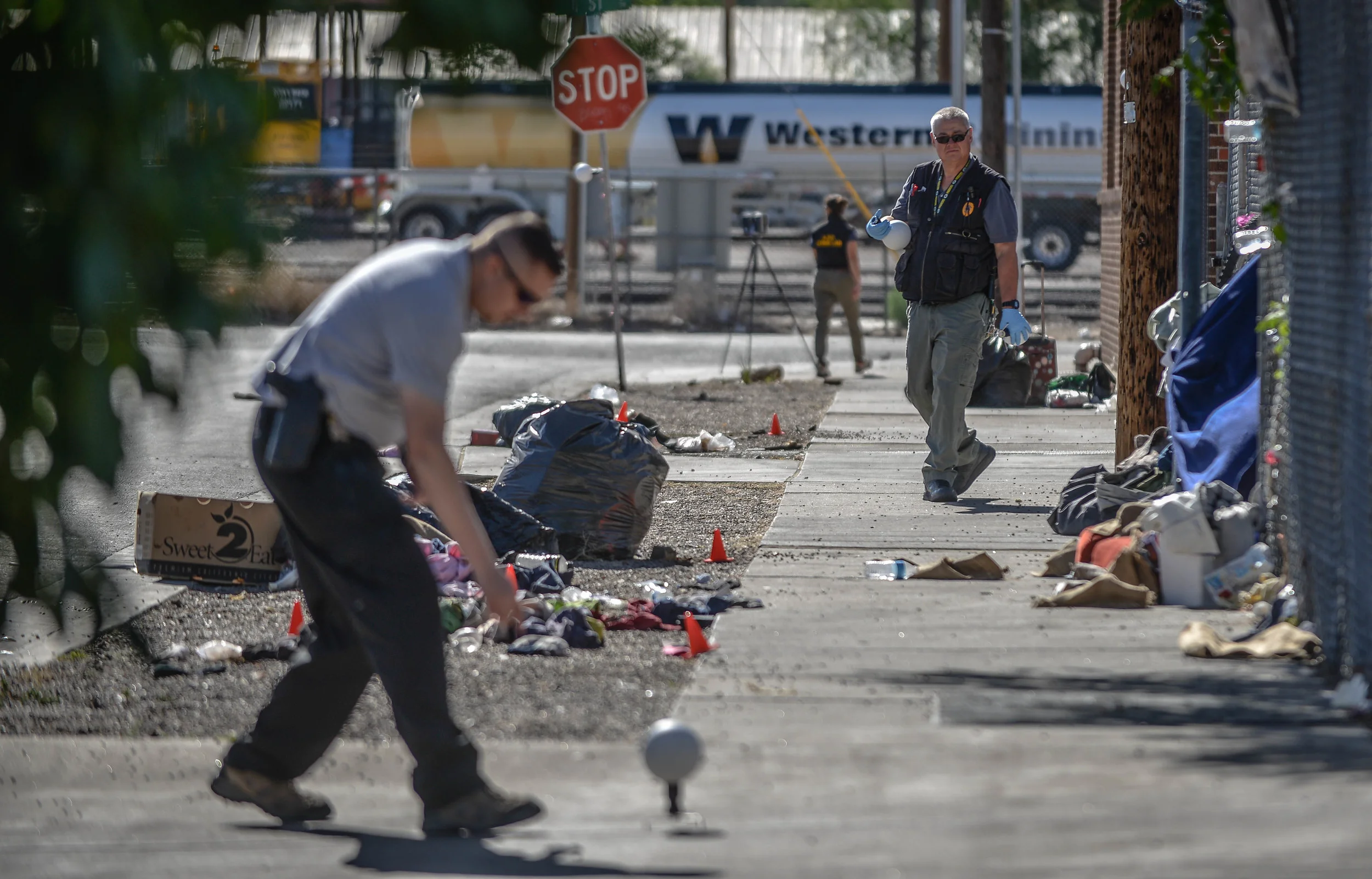 investigators at the scene where a homeless woman was rundown by an unidentified driver while she slept.