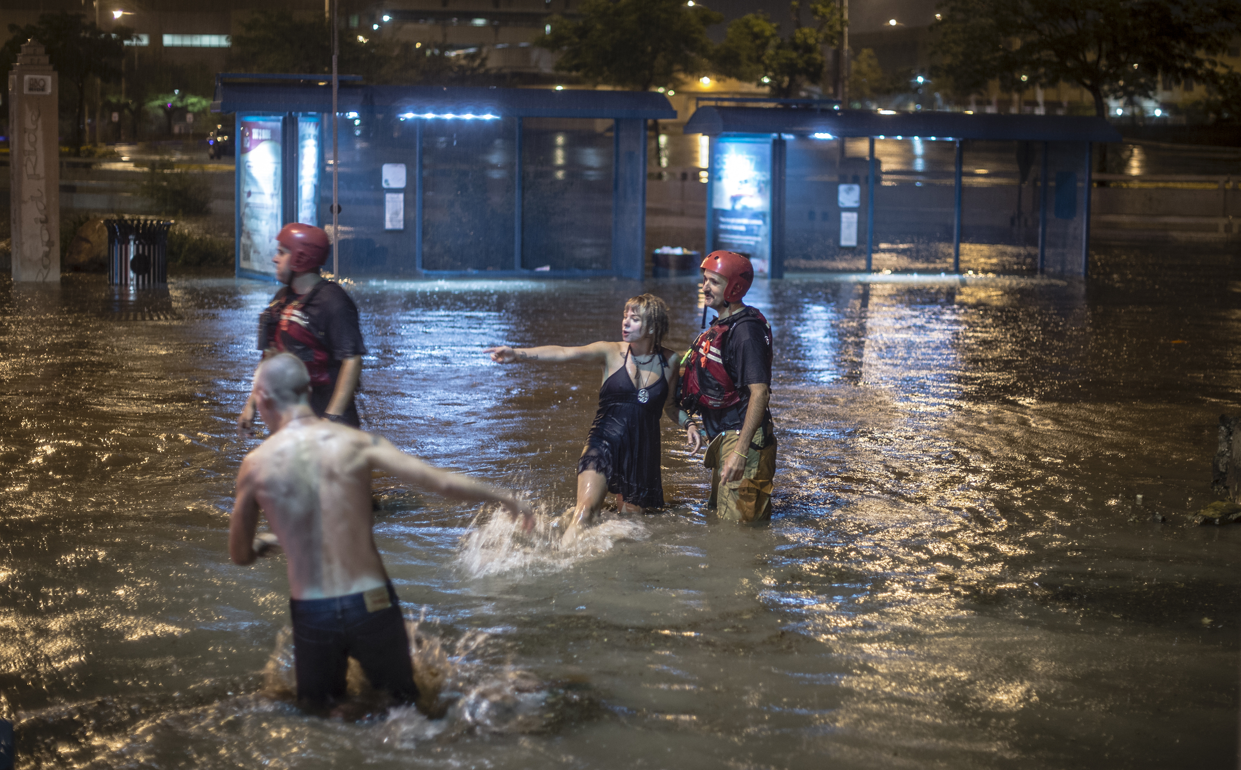 Two drivers had to be rescued by Albuquerque firefighters when their car flooded in the downtown area.