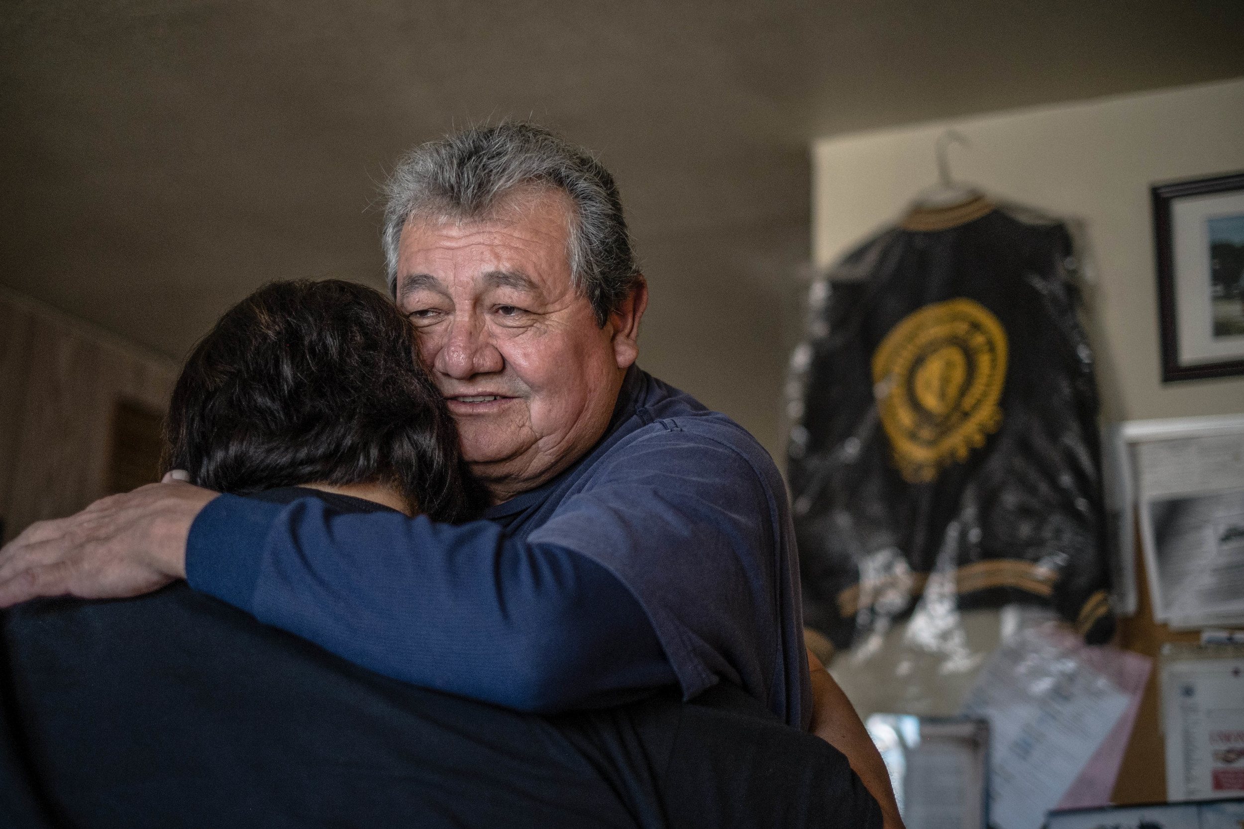 Ray Teran, a 40-year veteran of the Chino Mine, hugs Frances Gonzales, whose father was a longtime miner and union member. Teran was chairman of United Steelworkers Local 9424-3, which was decertified after a union election last month. (Roberto E. Rosales/Albuquerque Journal)