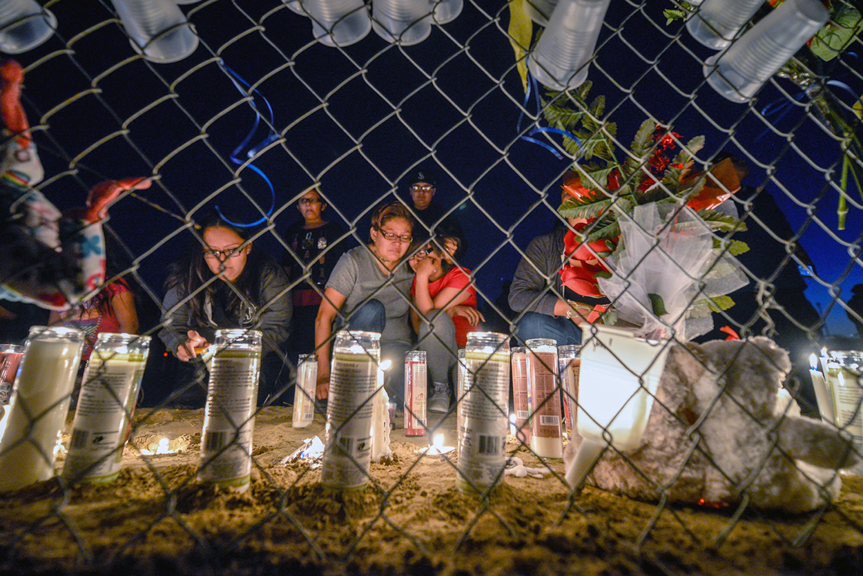 Mourners gather at a memorial for 11 year old Ashlynn Mike who was kidnapped and killed near Shiprock, New Mexico.