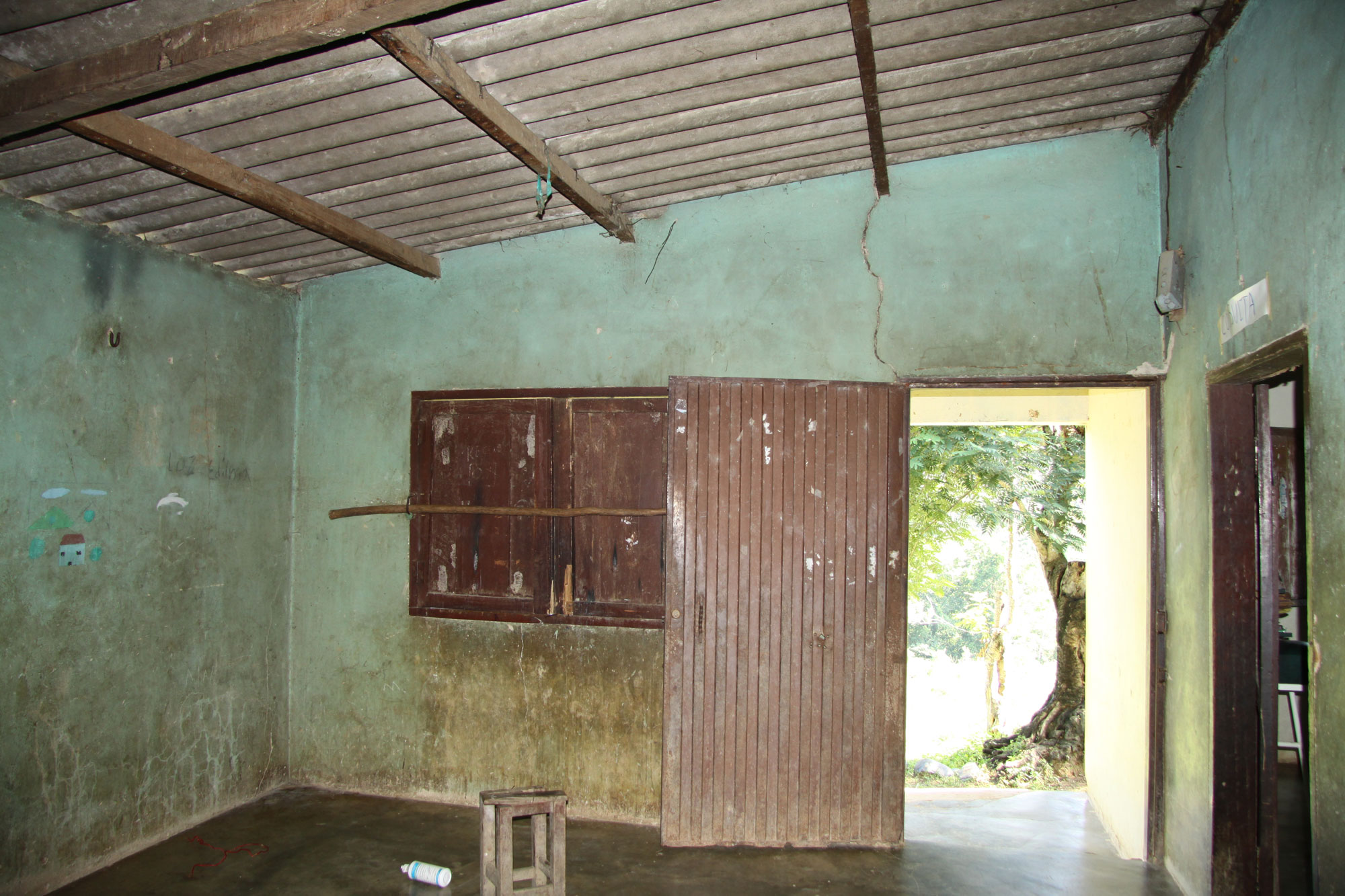 Health post with stained and cracked walls.