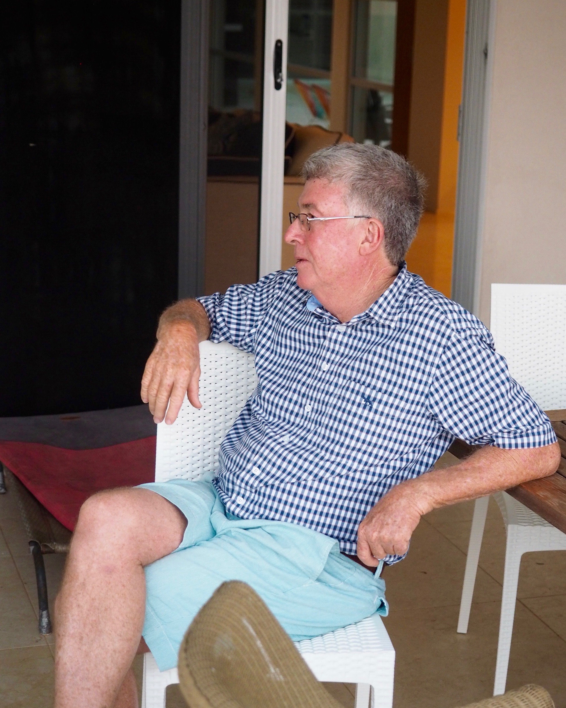 Ross Campbell sitting on his back porch at the Campbell house in Cleveland, Queensland, Australia.