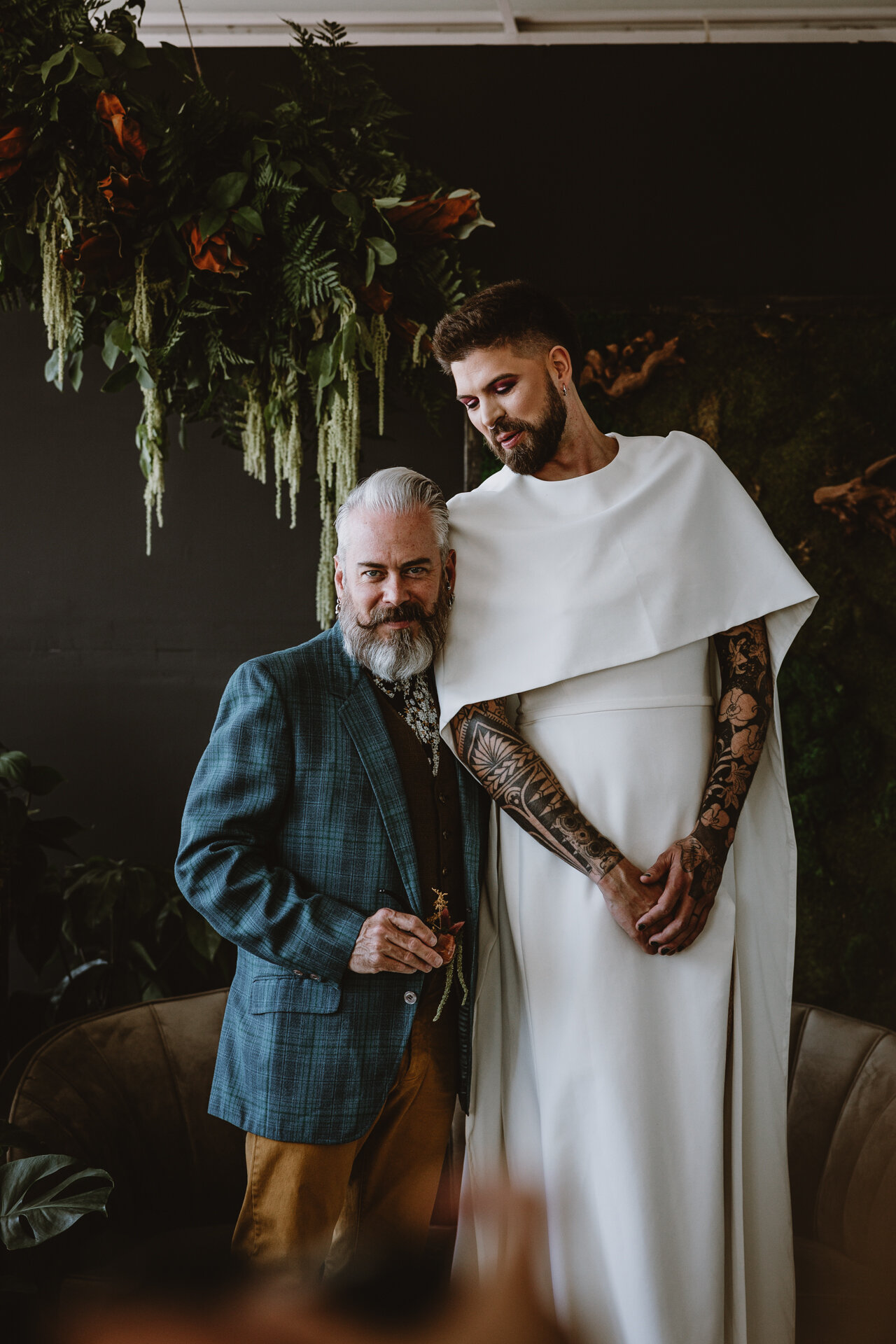  Lush + Leather intimate LGBTQIA+ styled shoot at Denver Photo Collective in the gorgeous Vagabond Zoe wedding gown and Eos cape photographed by Storih Photography 