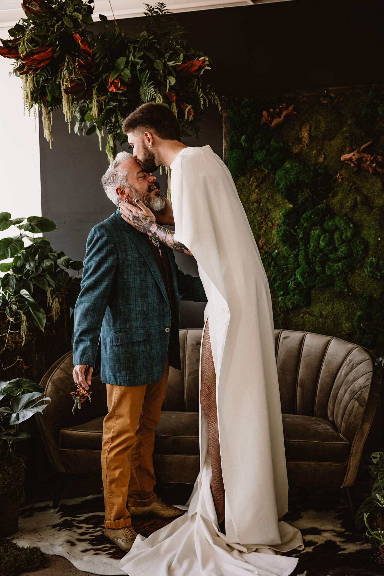  Lush + Leather intimate LGBTQIA+ styled shoot at Denver Photo Collective in the gorgeous Vagabond Zoe wedding gown and Eos cape photographed by Storih Photography 