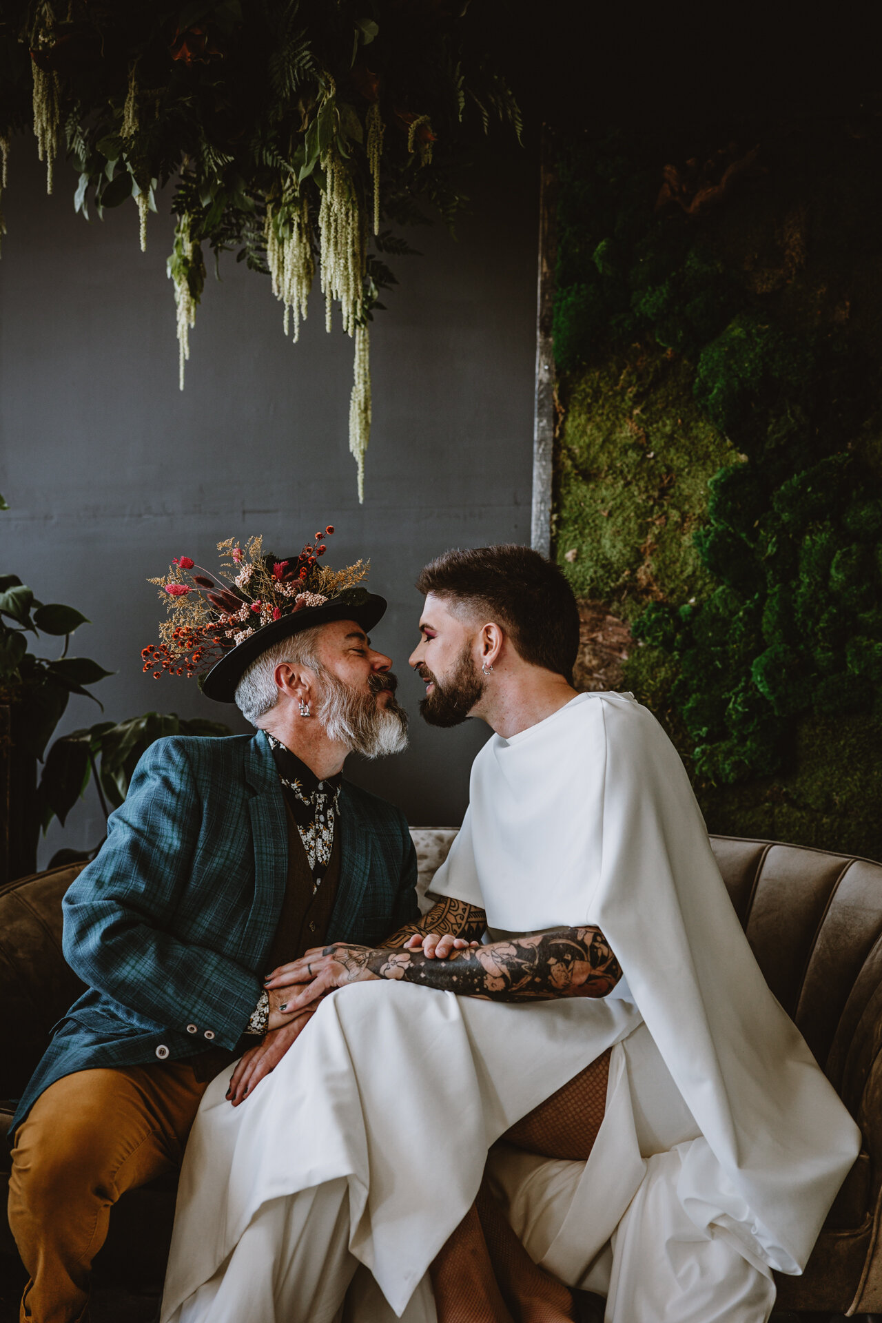  Lush + Leather intimate LGBTQIA+ styled shoot at Denver Photo Collective in the gorgeous Vagabond Zoe wedding gown and Eos cape photographed by Storih Photography 