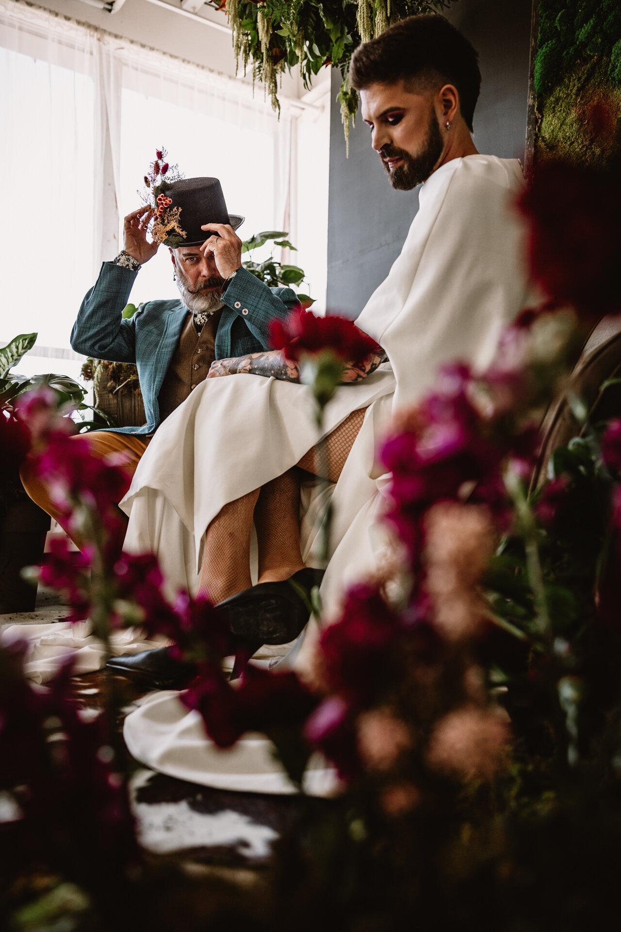  Lush + Leather intimate LGBTQIA+ styled shoot at Denver Photo Collective in the gorgeous Vagabond Zoe wedding gown and Eos cape photographed by Storih Photography 