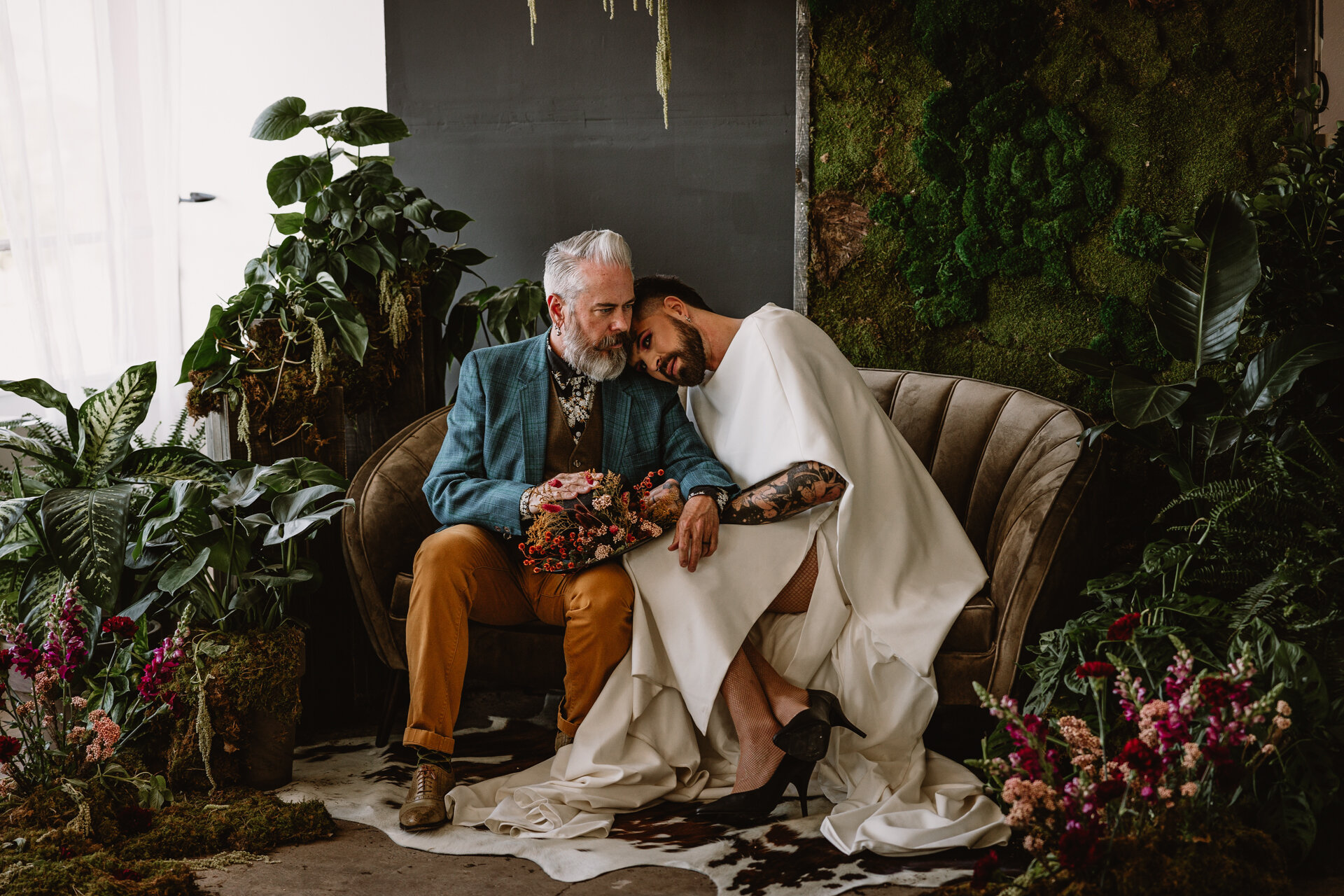  Lush + Leather intimate LGBTQIA+ styled shoot at Denver Photo Collective in the gorgeous Vagabond Zoe wedding gown and Eos cape photographed by Storih Photography 