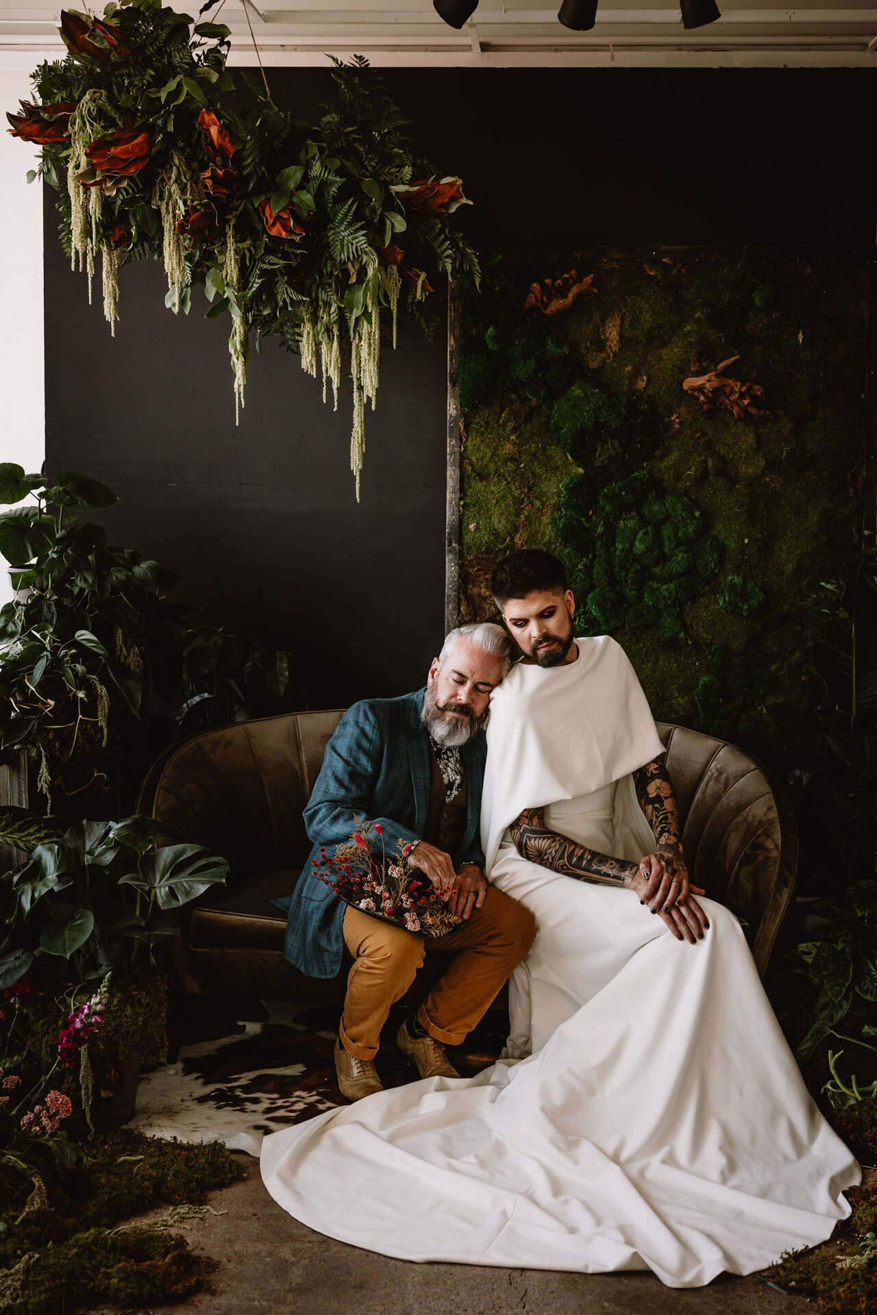  Lush + Leather intimate LGBTQIA+ styled shoot at Denver Photo Collective in the gorgeous Vagabond Zoe wedding gown and Eos cape photographed by Storih Photography 