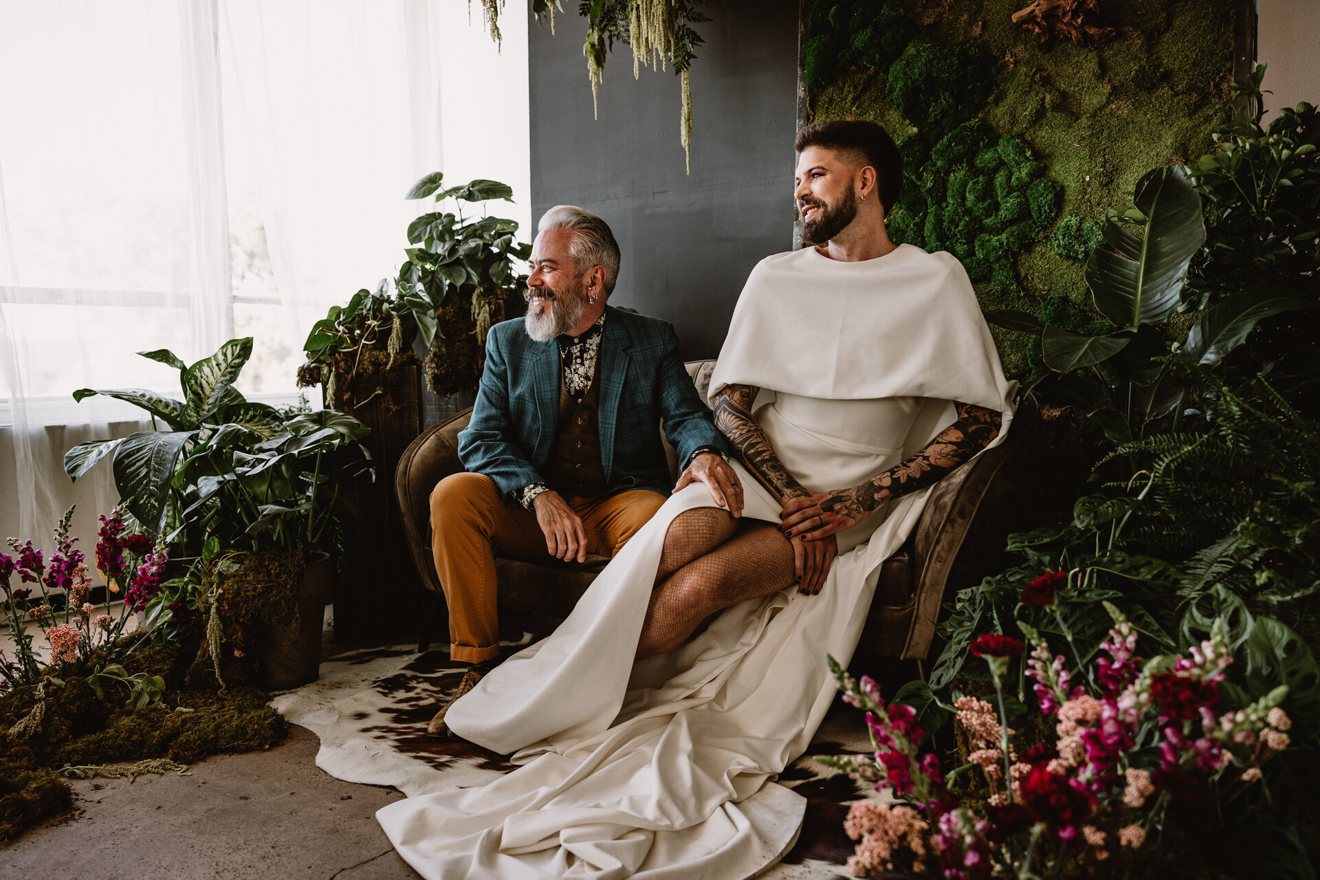  Lush + Leather intimate LGBTQIA+ styled shoot at Denver Photo Collective in the gorgeous Vagabond Zoe wedding gown and Eos cape photographed by Storih Photography 