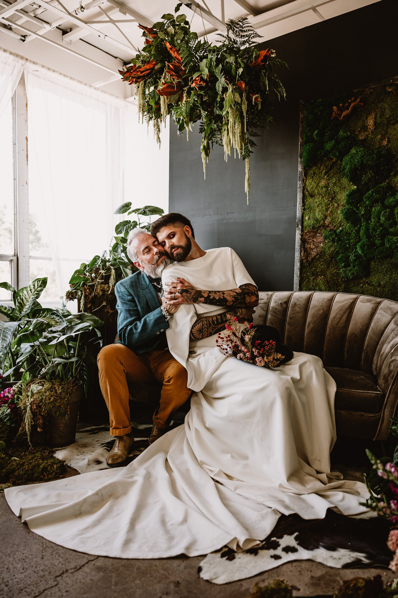  Lush + Leather intimate LGBTQIA+ styled shoot at Denver Photo Collective in the gorgeous Vagabond Zoe wedding gown and Eos cape photographed by Storih Photography 