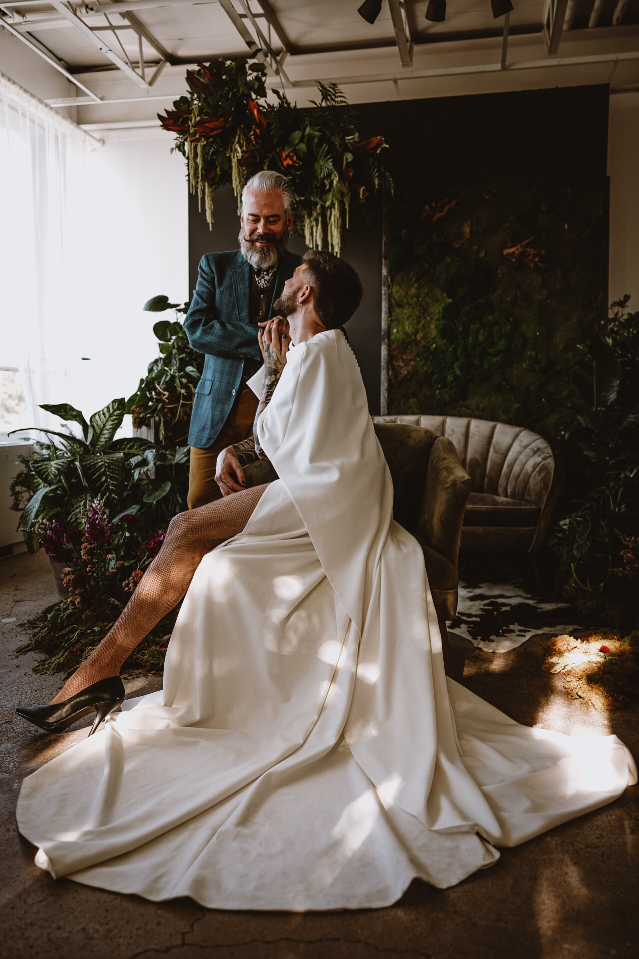  Lush + Leather intimate LGBTQIA+ styled shoot at Denver Photo Collective in the gorgeous Vagabond Zoe wedding gown and Eos cape photographed by Storih Photography 