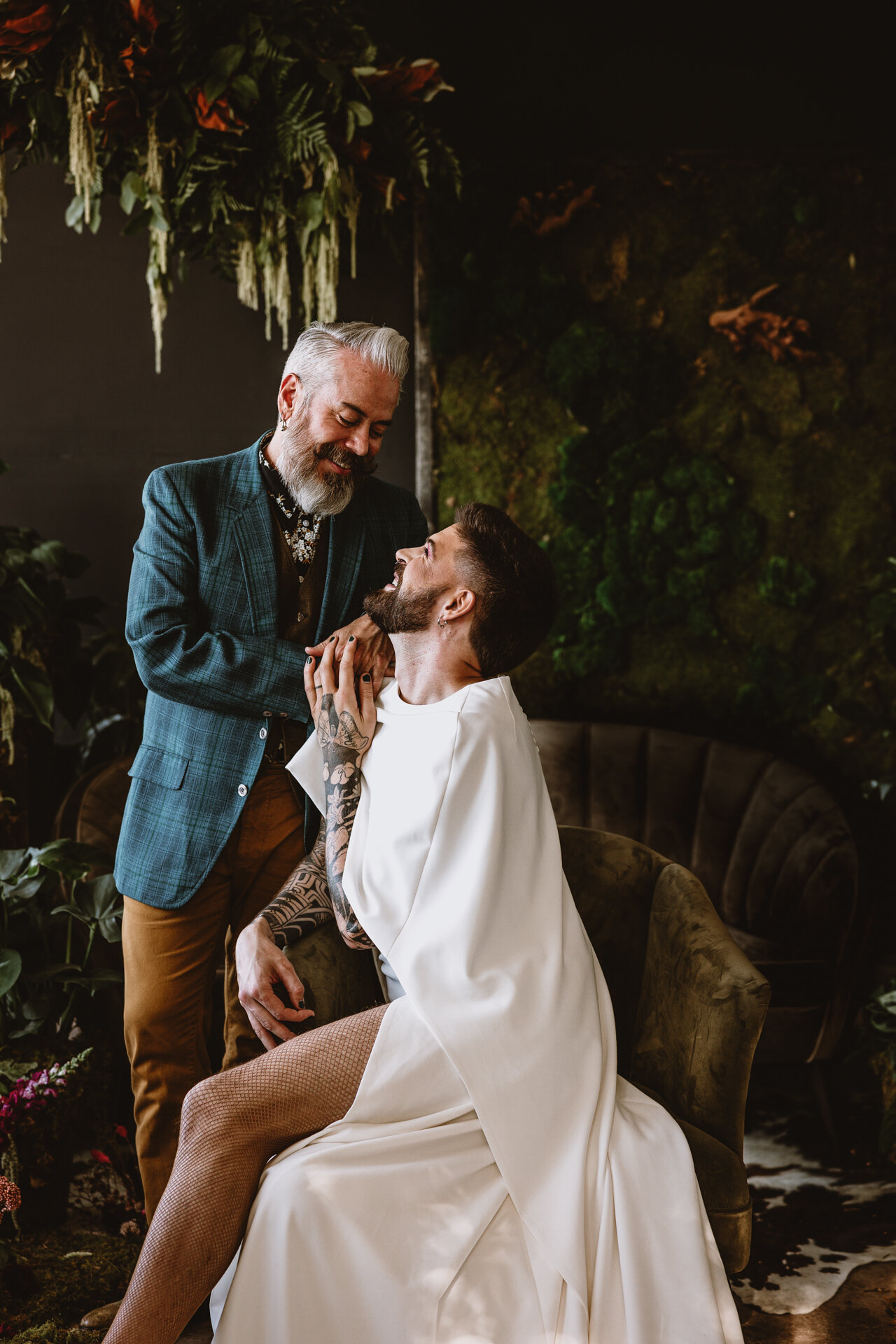  Lush + Leather intimate LGBTQIA+ styled shoot at Denver Photo Collective in the gorgeous Vagabond Zoe wedding gown and Eos cape photographed by Storih Photography 