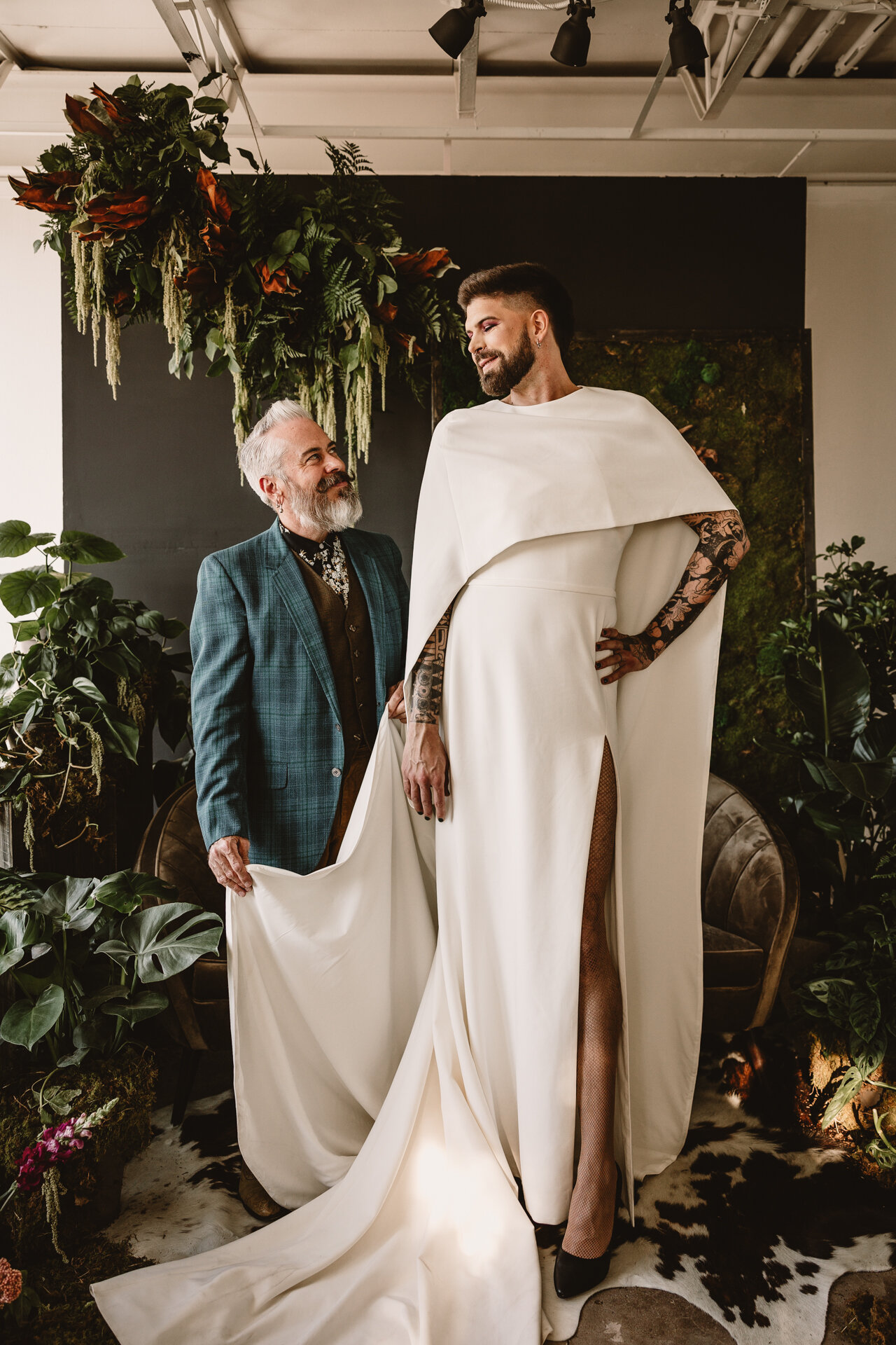  Lush + Leather intimate LGBTQIA+ styled shoot at Denver Photo Collective in the gorgeous Vagabond Zoe wedding gown and Eos cape photographed by Storih Photography 