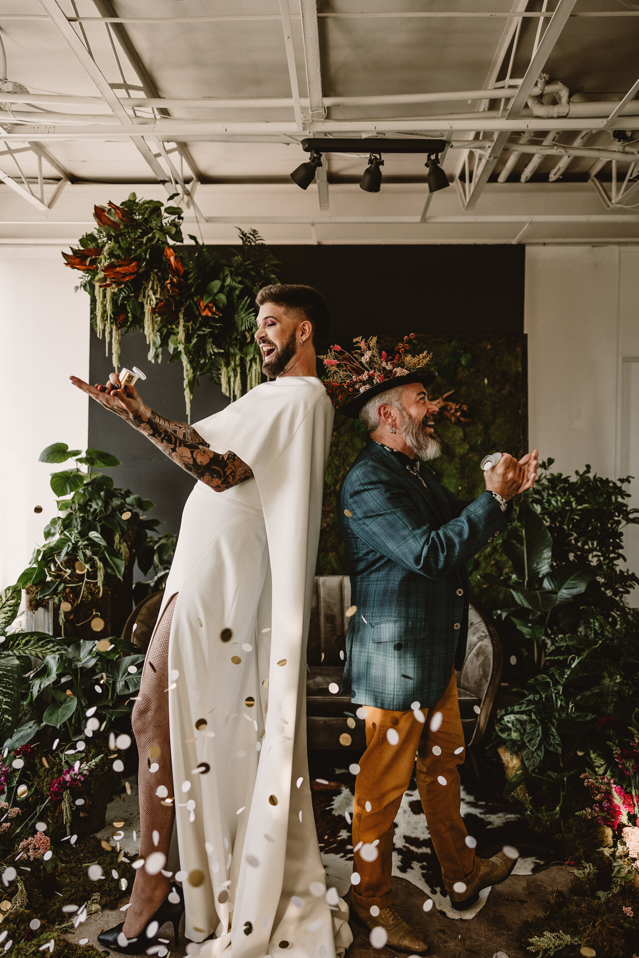  Lush + Leather intimate LGBTQIA+ styled shoot at Denver Photo Collective in the gorgeous Vagabond Zoe wedding gown and Eos cape photographed by Storih Photography 