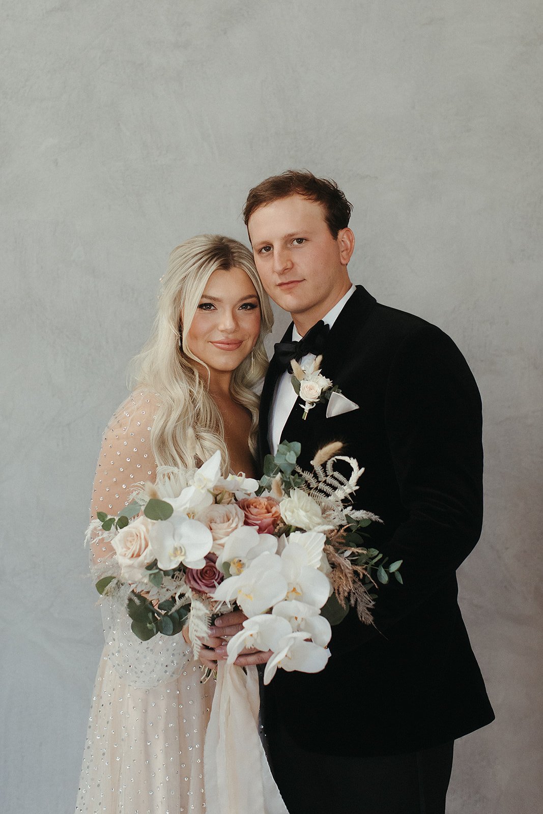  A bride wearing Lunella by Willowby by Watters, with long sleeve sheer bishop sleeves and a deep-v bodice and soft aline skirt. 
