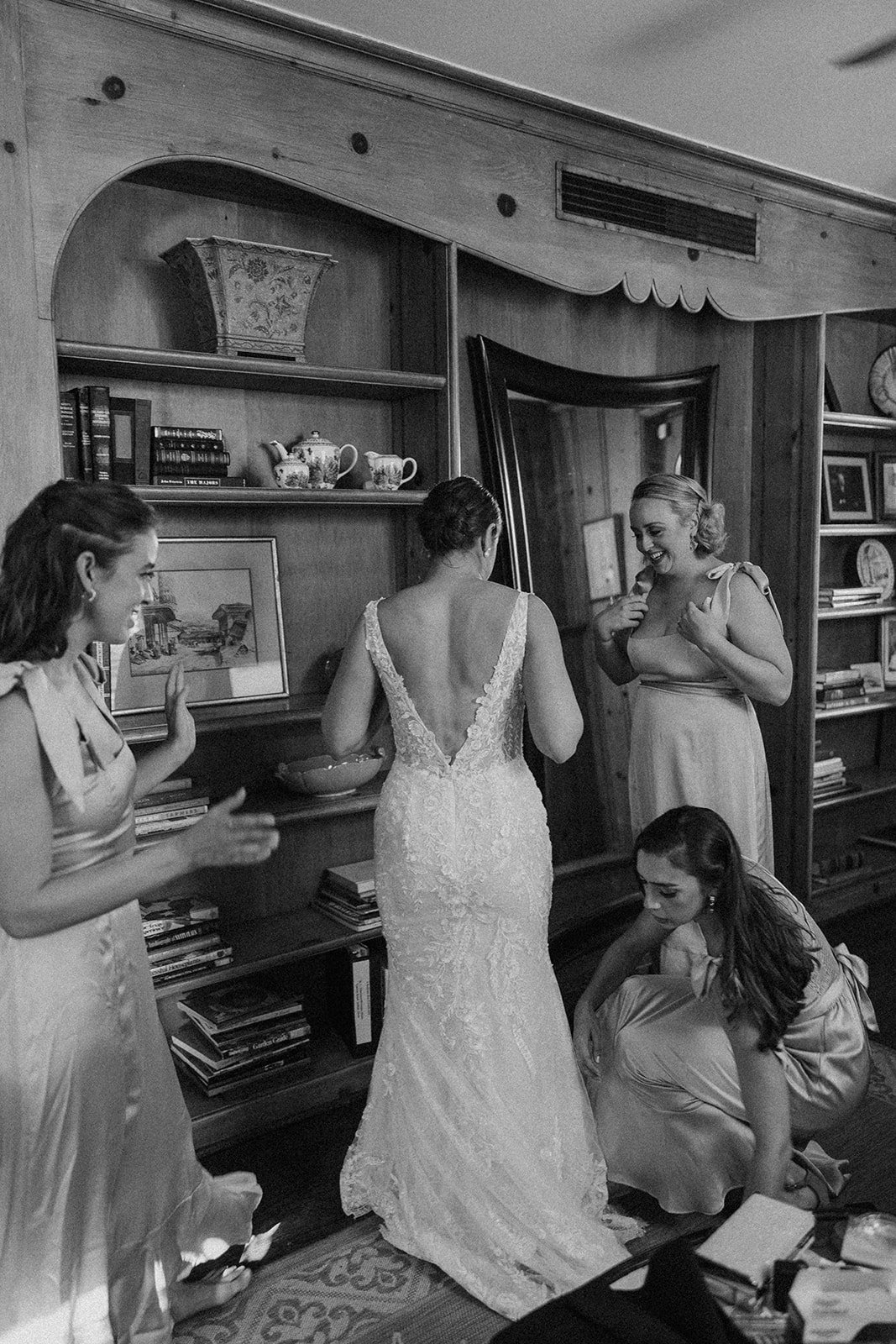  a bride in 'Lucia' by Wtoo wedding dress getting ready with their bridesmaids for their big day. 