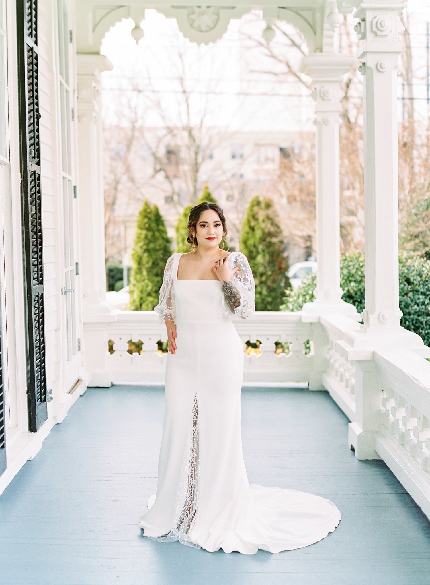  a lovely fitted crepe wedding dress with sheer puff sleeves, a square neck, inset lace in the skirt slit, and a low back — florence by laudae bridal 