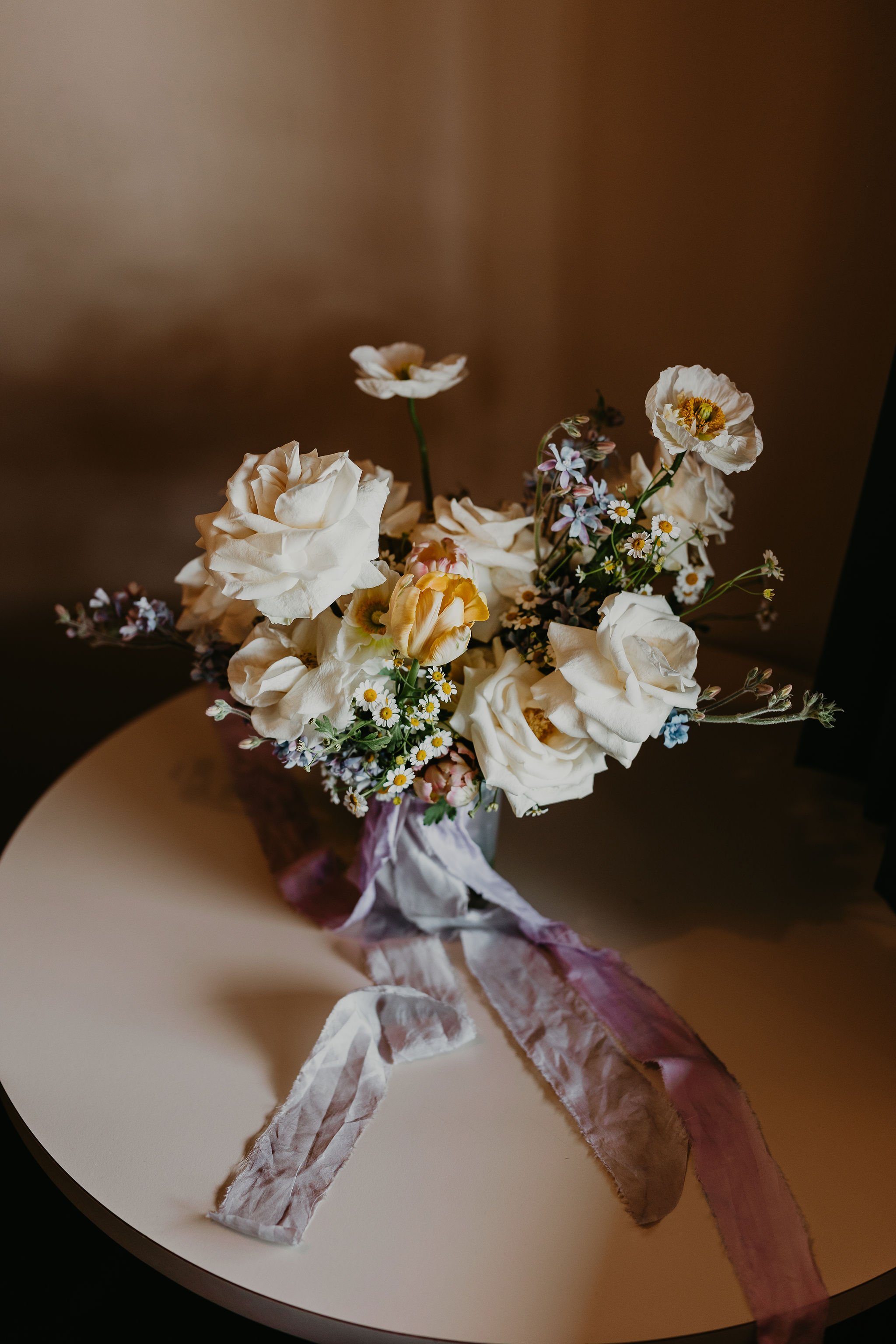  a romantic bridal bouquet with silk ribbon for a boise idaho mountain elopement in the snow 