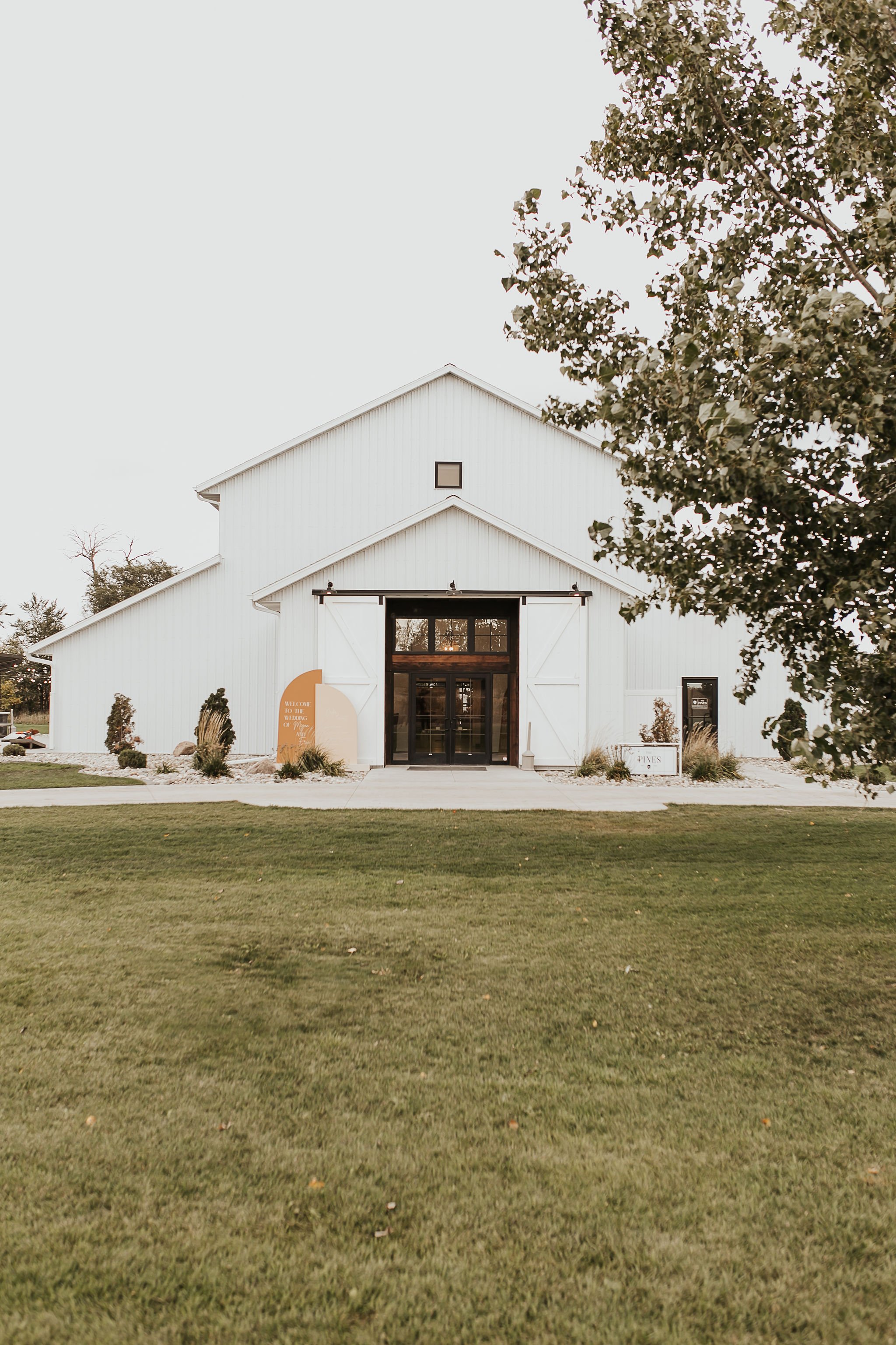 modern barn wedding featuring alyssa kristin wedding dress