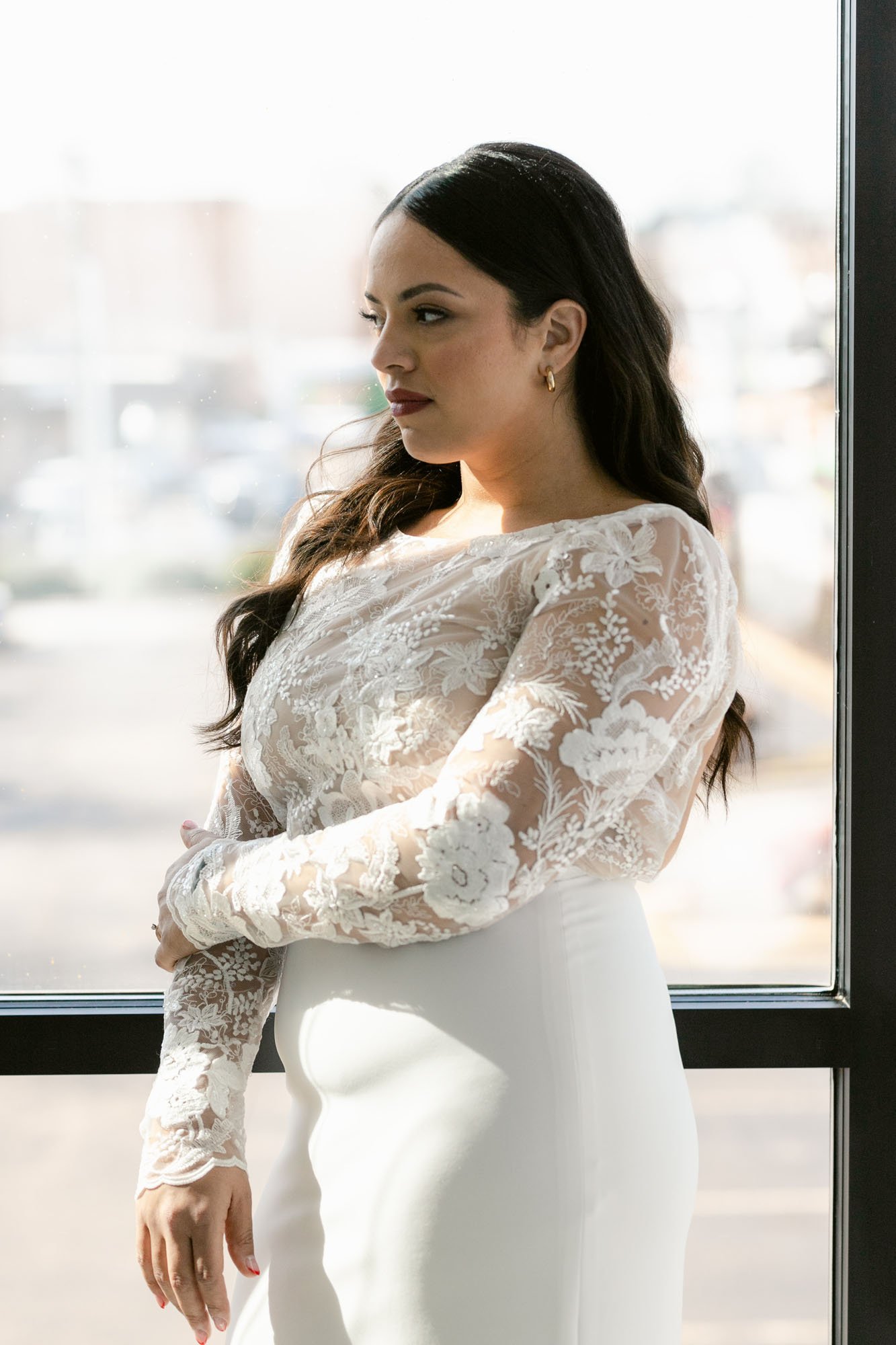 blake by anais anette x aandbe bridal shop is a long sleeve lace and crepe skirt wedding dress