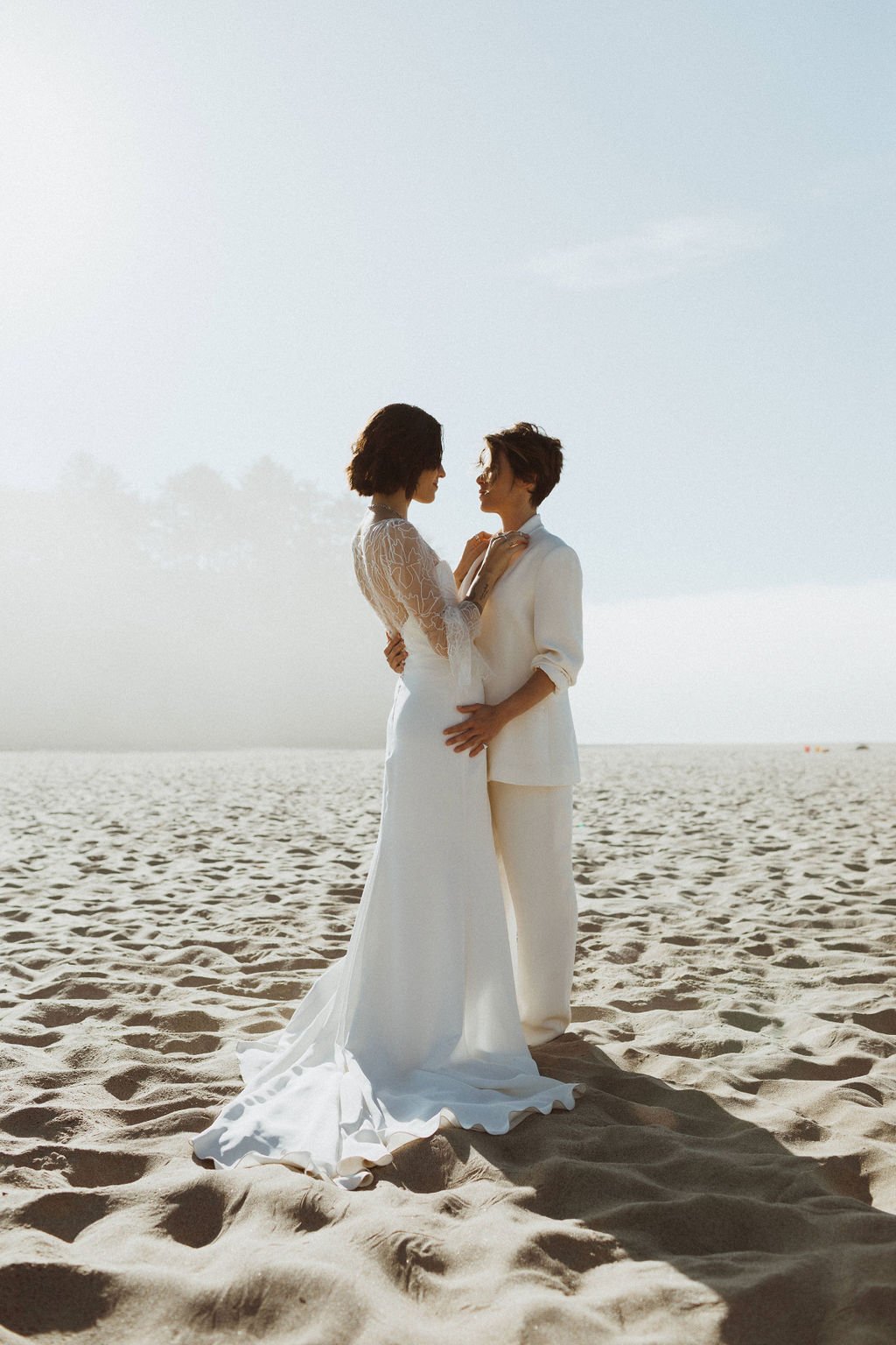 lgbtq+ beach wedding inspiration featuring alexandra grecco wedding dress