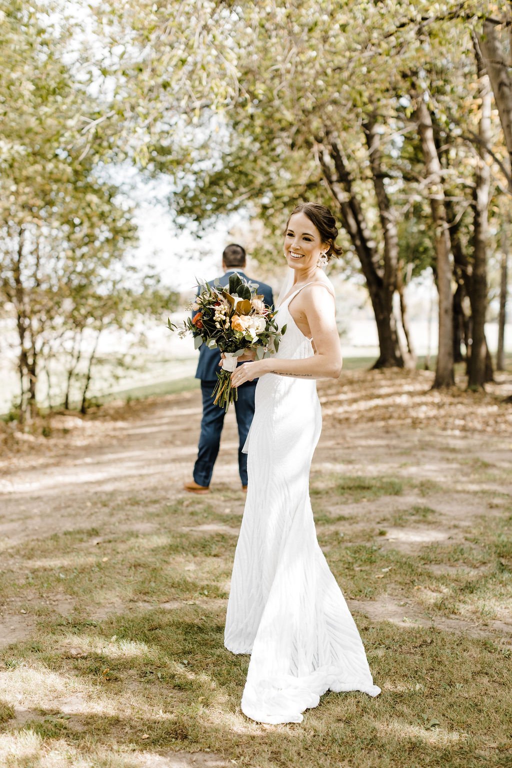 bright and sunny first look photos in an alyssa kristin wedding dress