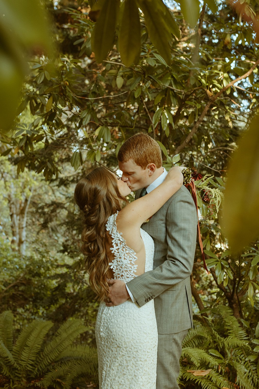 real bride wearing a textured floral wedding dress by laudae