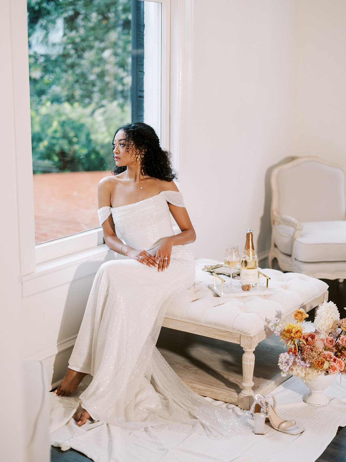a statement sparkly off the shoulder alena leena wedding dress in a brides of austin styled shoot at a mansion in austin texas.