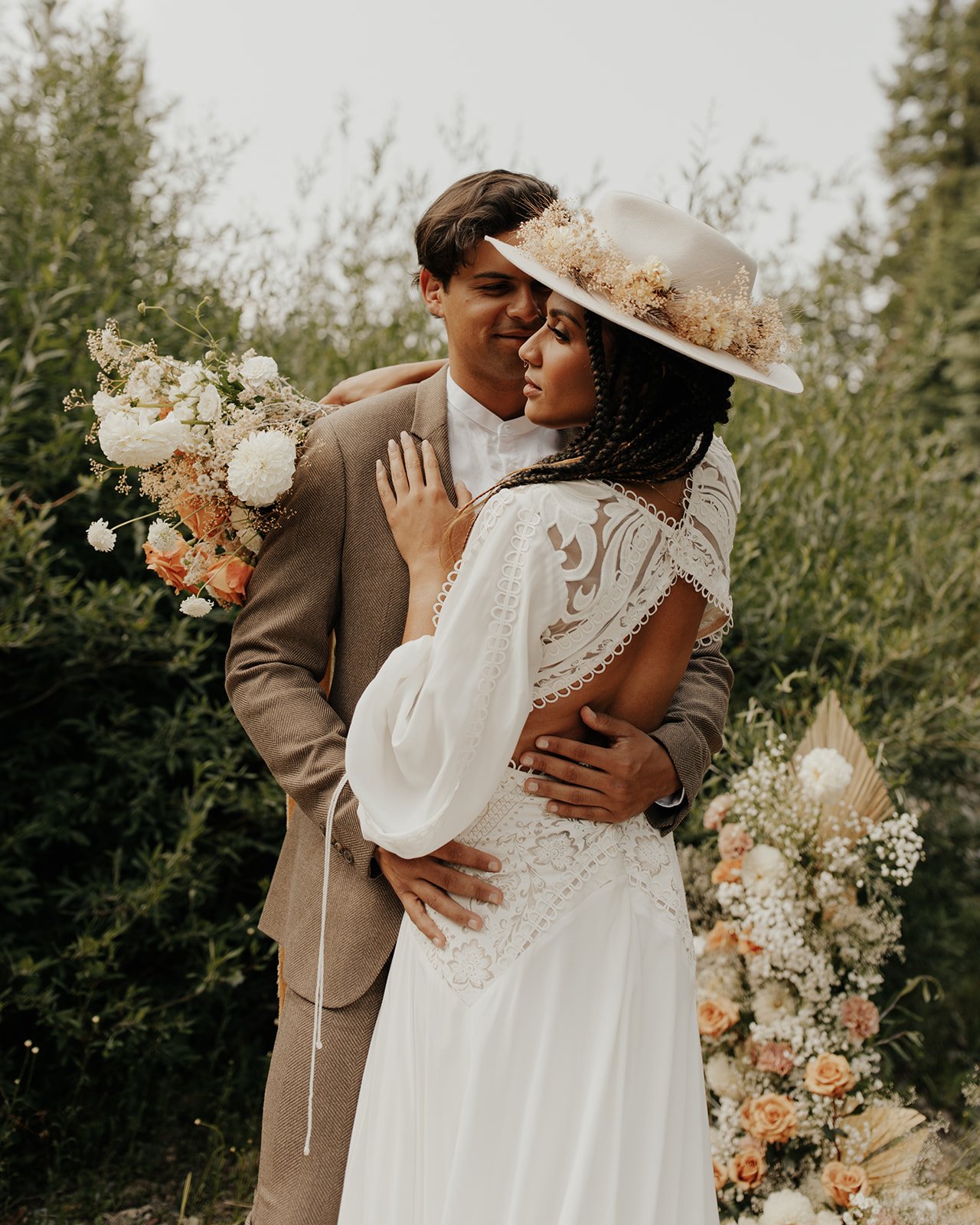 an open back boho wedding dress with sleeves by rue de seine in a wild woodsy styled shoot.