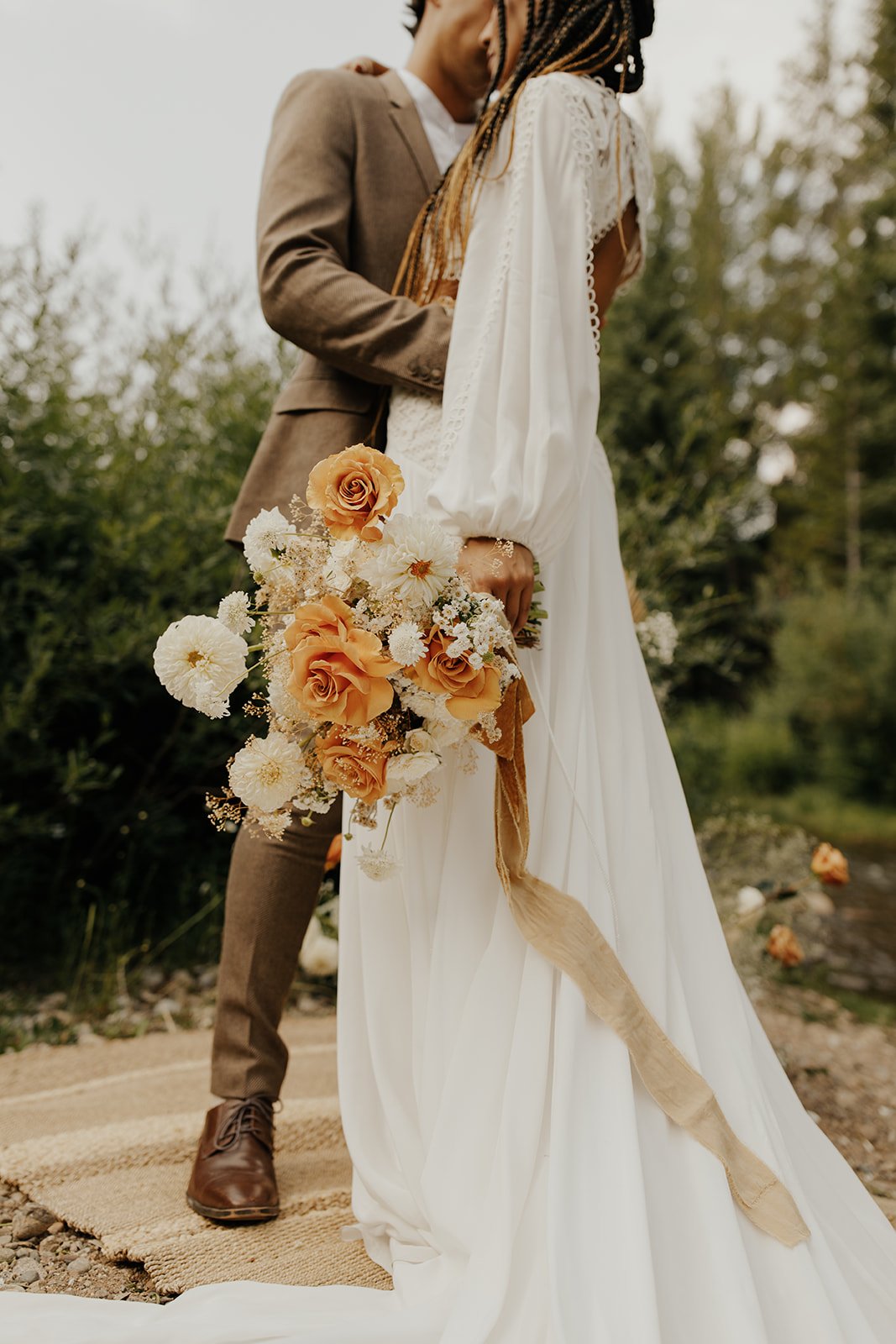 a boho rue de seine wedding dress in a secluded cabin in the woods styled shoot in colorado.