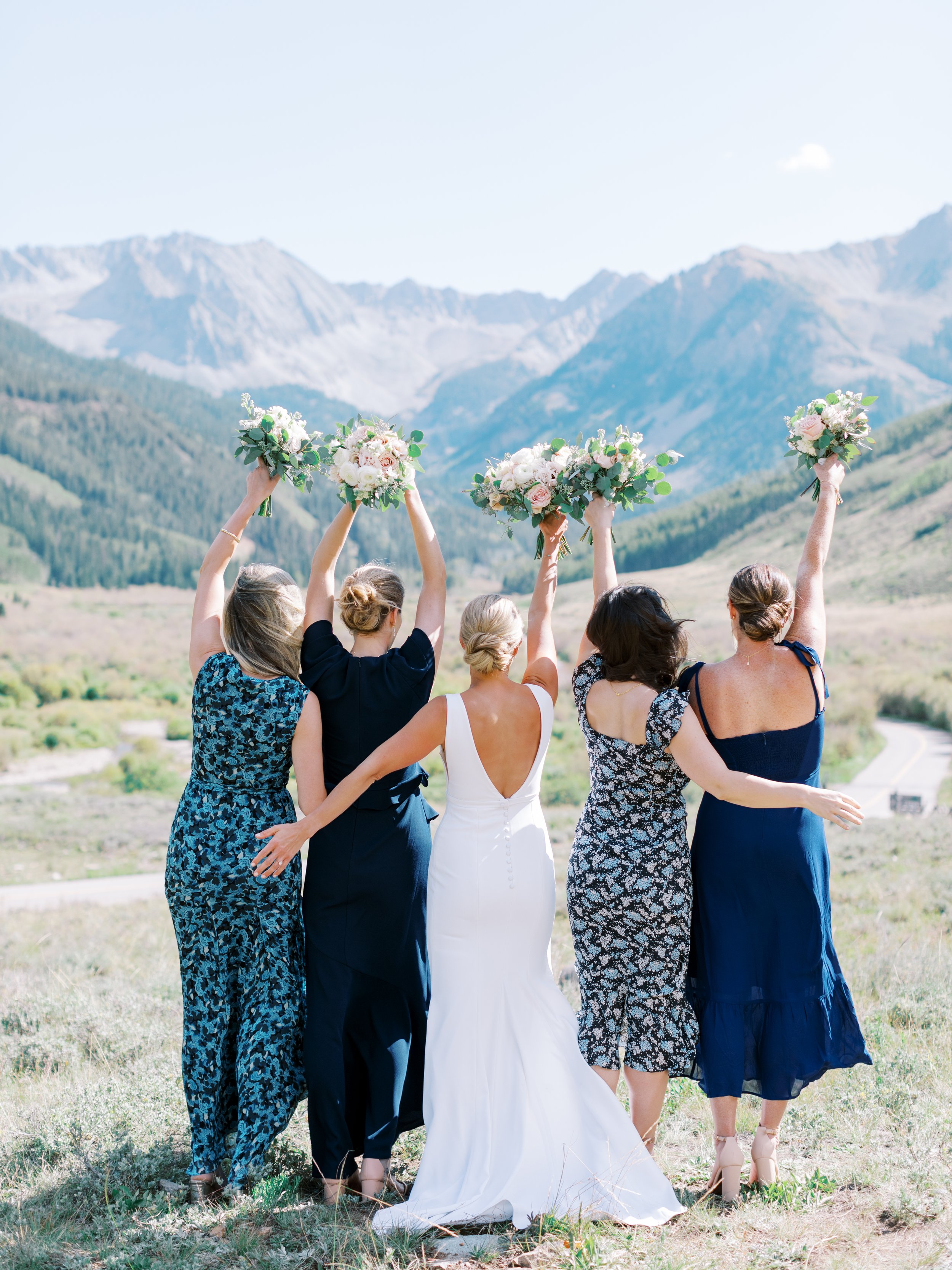 aspen wedding with blue color theme for bridesmaids dresses featuring a alyssa kristin chic crepe wedding dress.